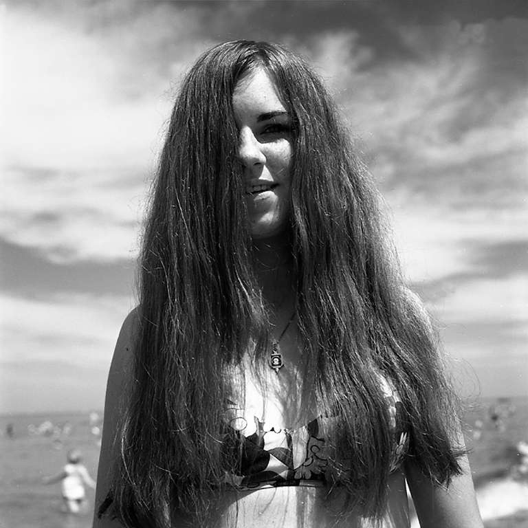 Vivian Maier Black and White Photograph - Wilmette, IL (Girl with Long Hair at Beach), 1968