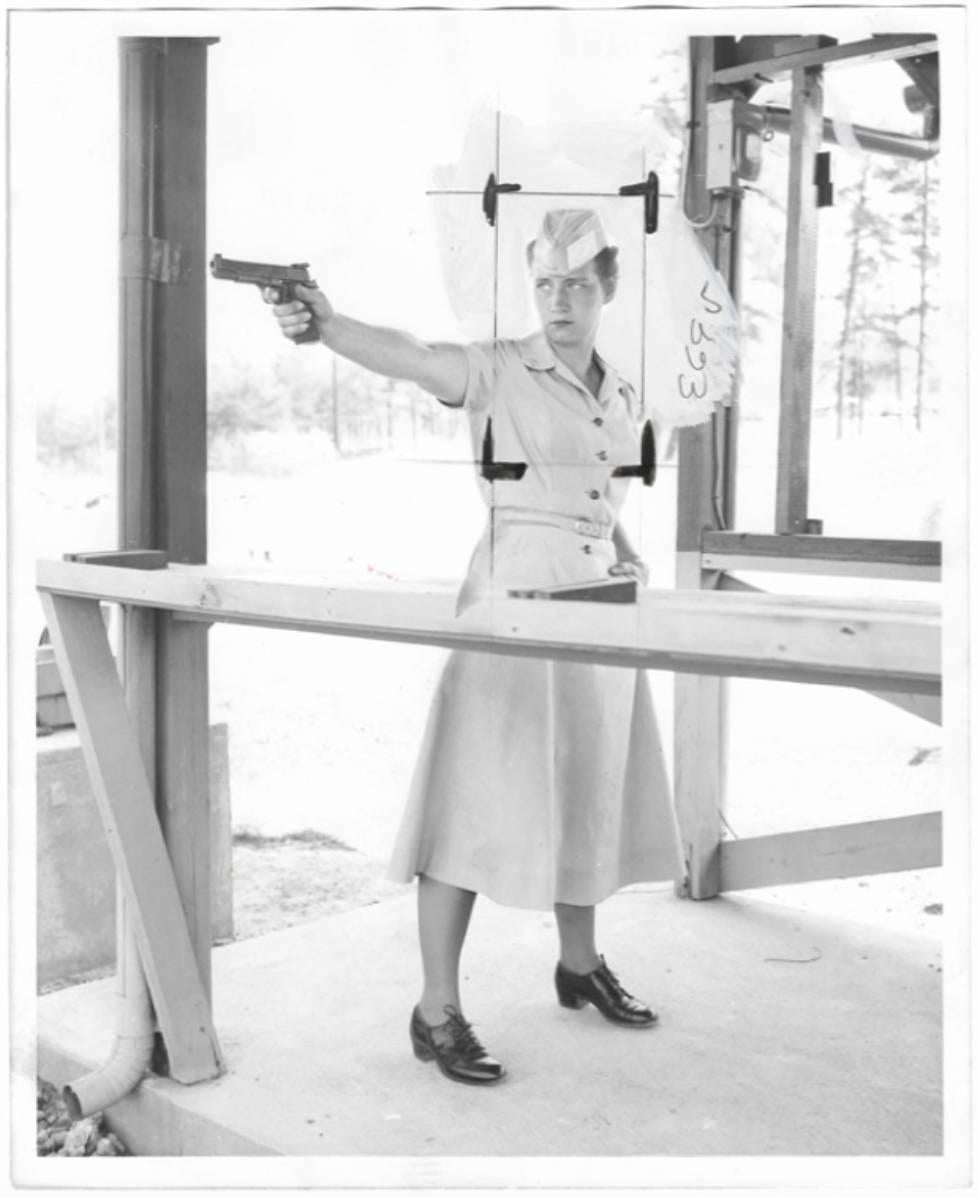 William Mullaly Figurative Photograph - PFC Nancy A. Abracham, Firing Pistol
