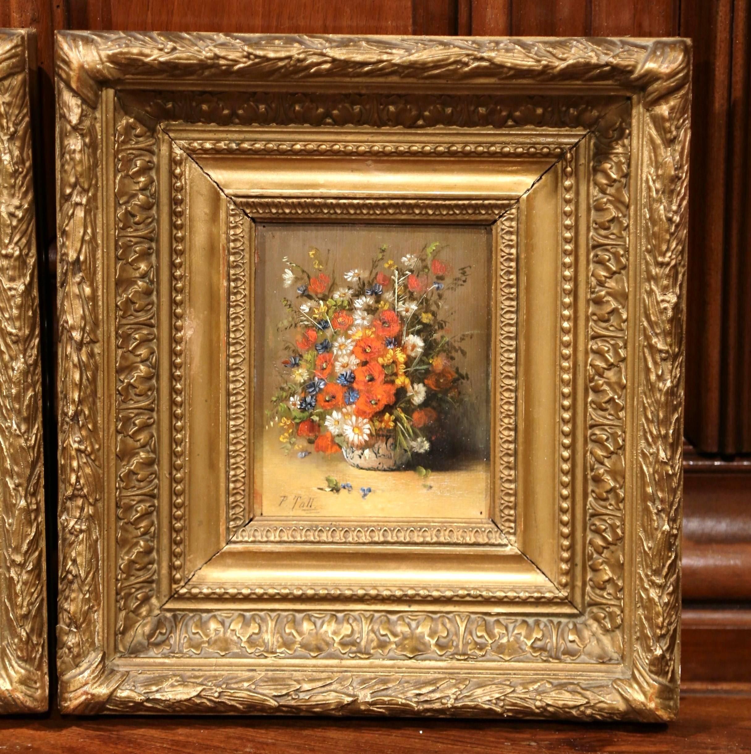 Elegant pair of antique paintings on board from France; hand painted circa 1880, each piece features a beautiful vase with bouquet of flowers. The paintings with the original carved gilt frame are signed P. Tall on the lower left. Excellent