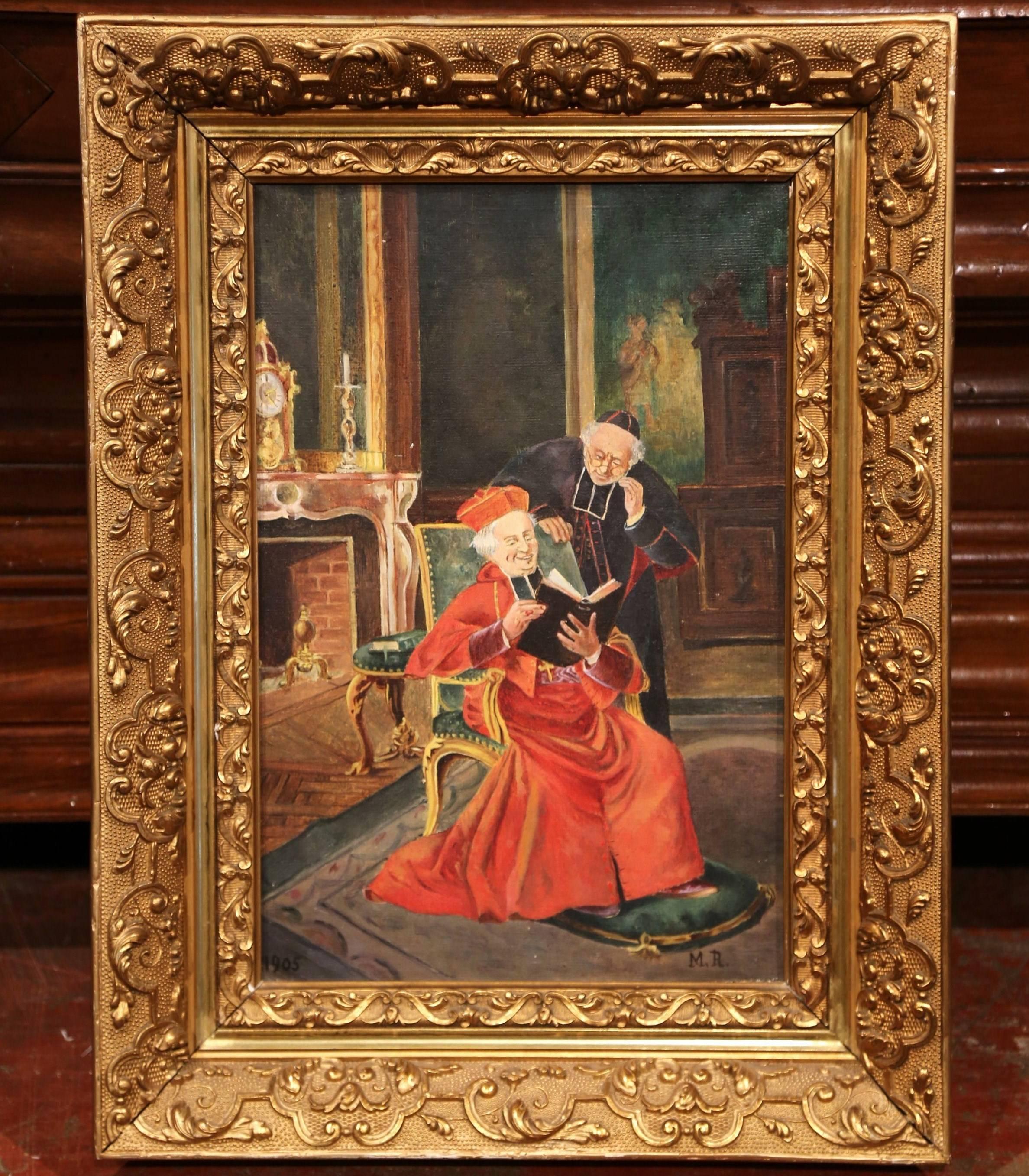 Beautiful antique oil on canvas in carved gilt wood frame; crafted in France, the painting depicts a religious interior scene with a seated Cardinal reading while a standing priest is looking on. The art work is signed on the bottom right M. R. and
