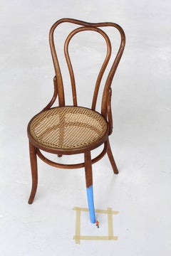 Untitled (man painting chair II)