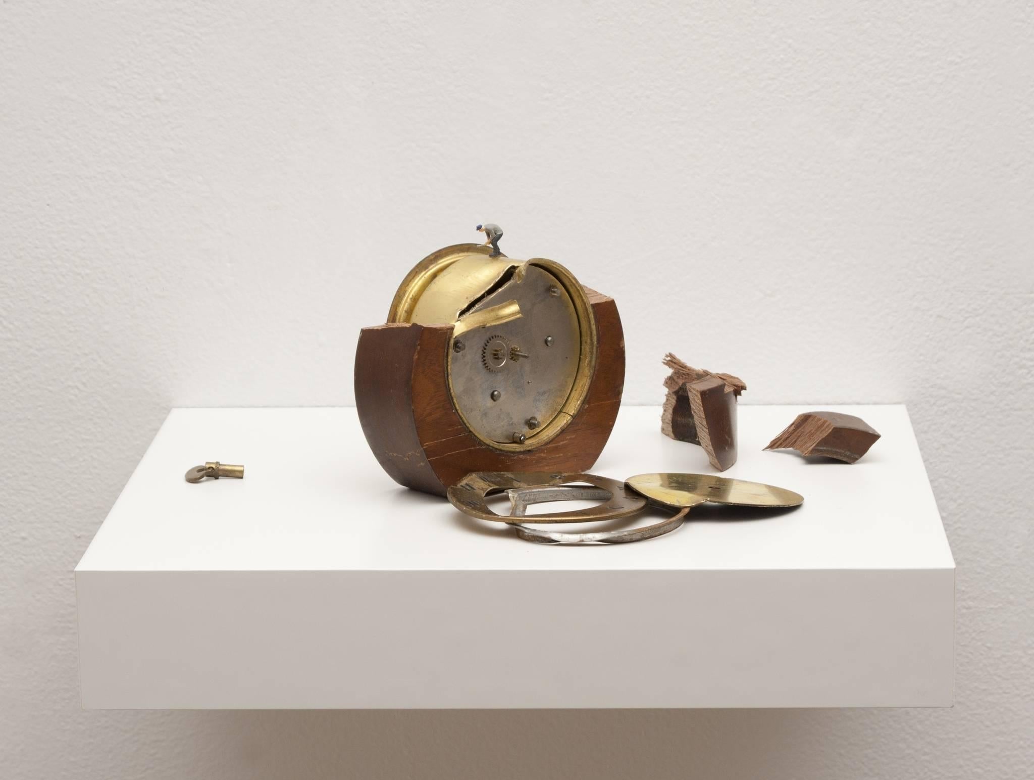 Liliana Porter Figurative Sculpture - To Fix It II (round clock)