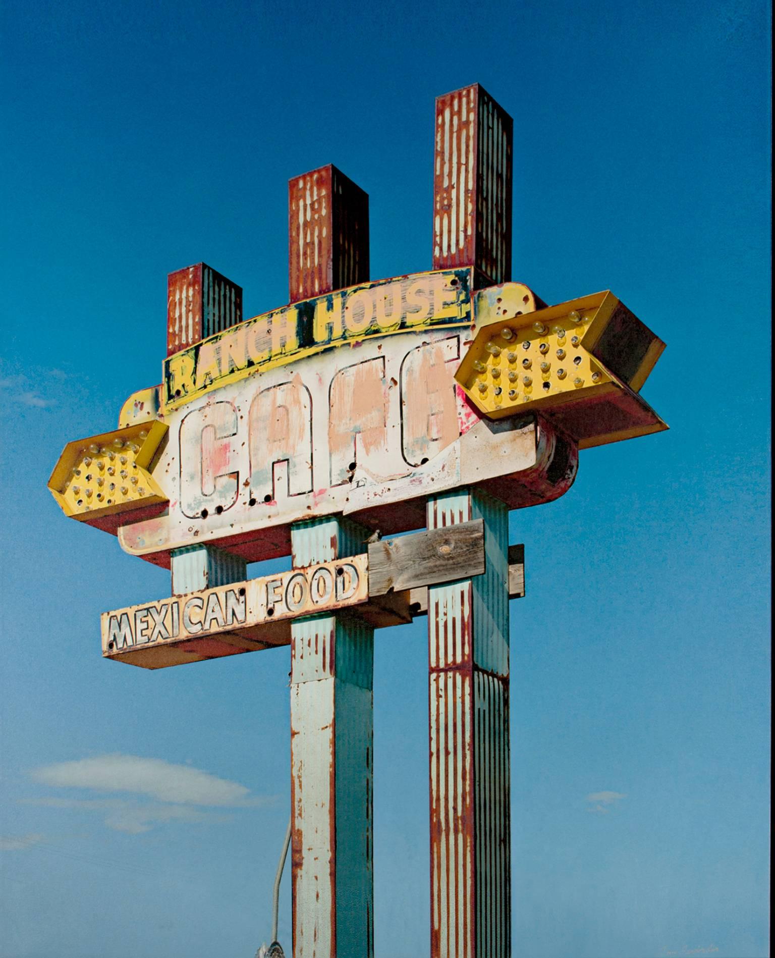 "Tucumcari Ranch House Cafe Sign, NM" is a color photograph printed on paper and signed lower right by the artist, Thomas Ferderbar. It depicts a large fading cafe sign against a bright blue sky. 

48" x 36" art
51 1/4" x 38 3/4" framed

Artist