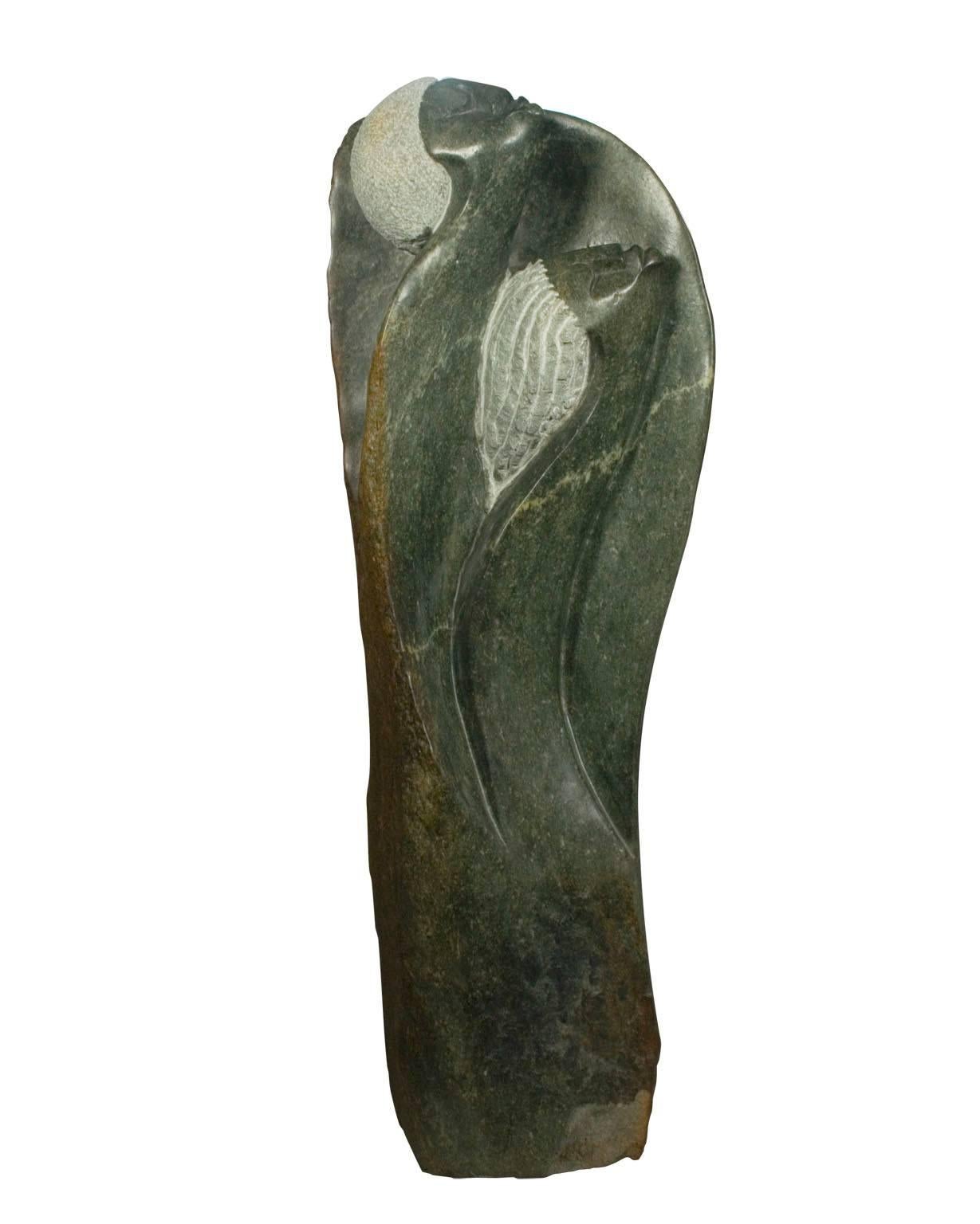 "Protected Spirits" is a sculpture carved from Opal stone signed Picket, who is part of the Shona tribe in Zimbabwe. It depicts two abstracted figures, presumably spirits, seeming to float upwards. 

38 1/2" x 13 1/2" x 7 1/4" 

Picket Mazhindu