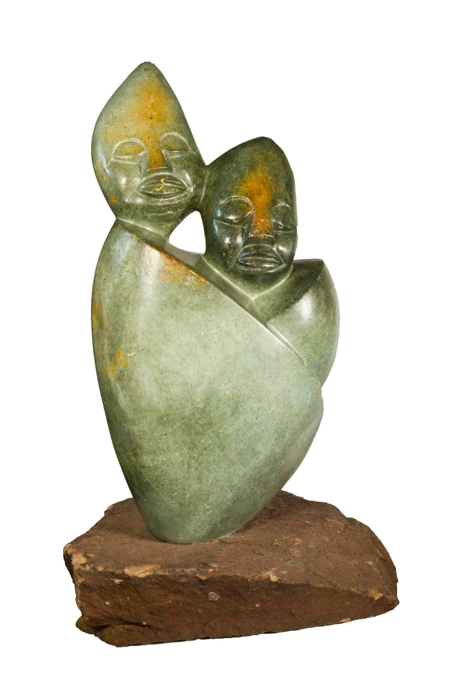 "Together Forever" is an opal sculpture created by Shona artists Tendai Marowa and Stanley Chideu. It depicts two figures permanently embraced with calm expressions on their faces. 

19" x 10" x 5 1/2" sculpture

Shona artists and crafts people have
