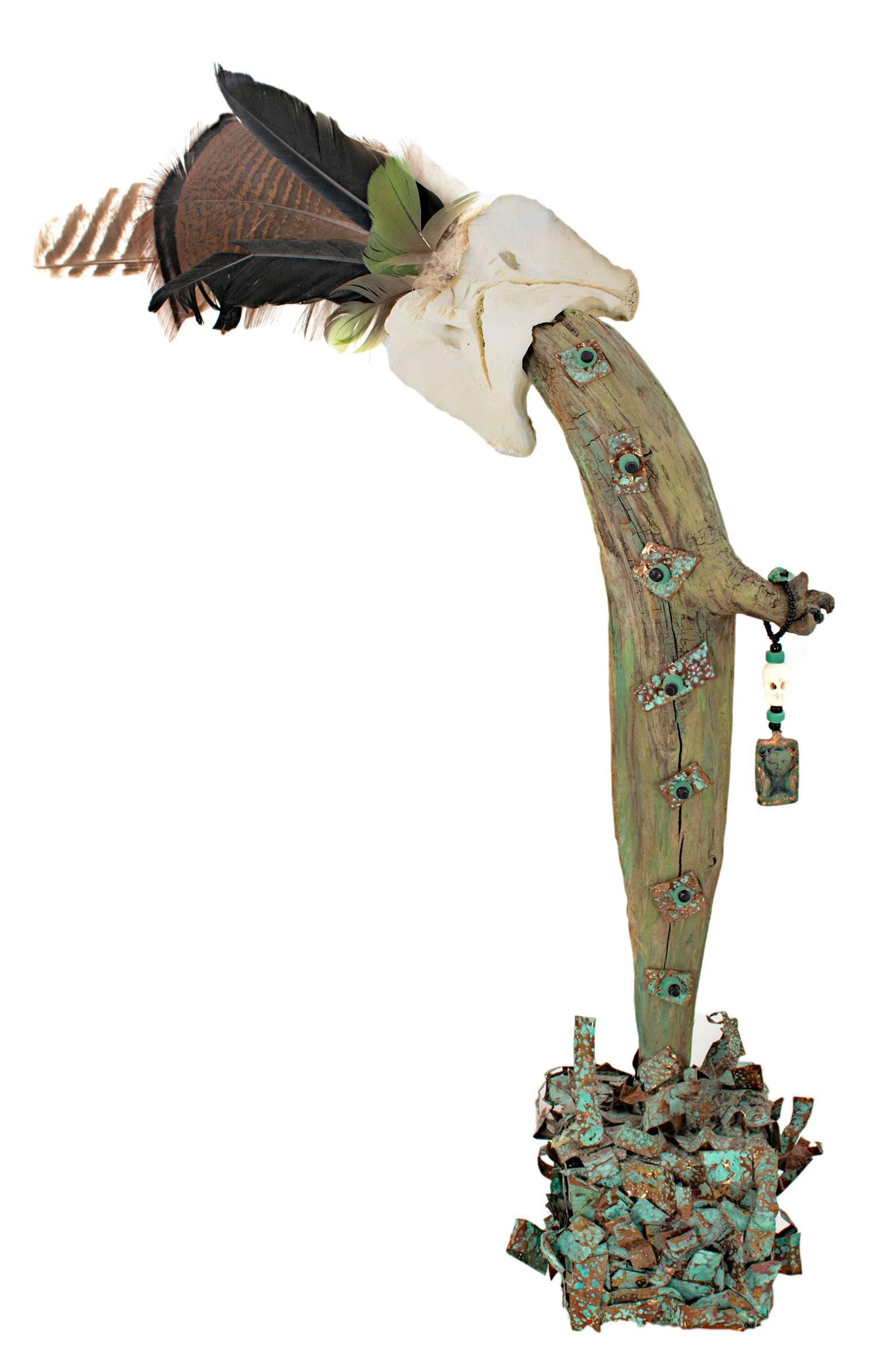 "The Guardian" is an original sculpture by Kyle Zubatsky. It was constructed out of juniper wood, copper, beads, bone, and feathers, and was signed by the artist. The piece represents an abstracted human figure, perhaps the kind found in stories of