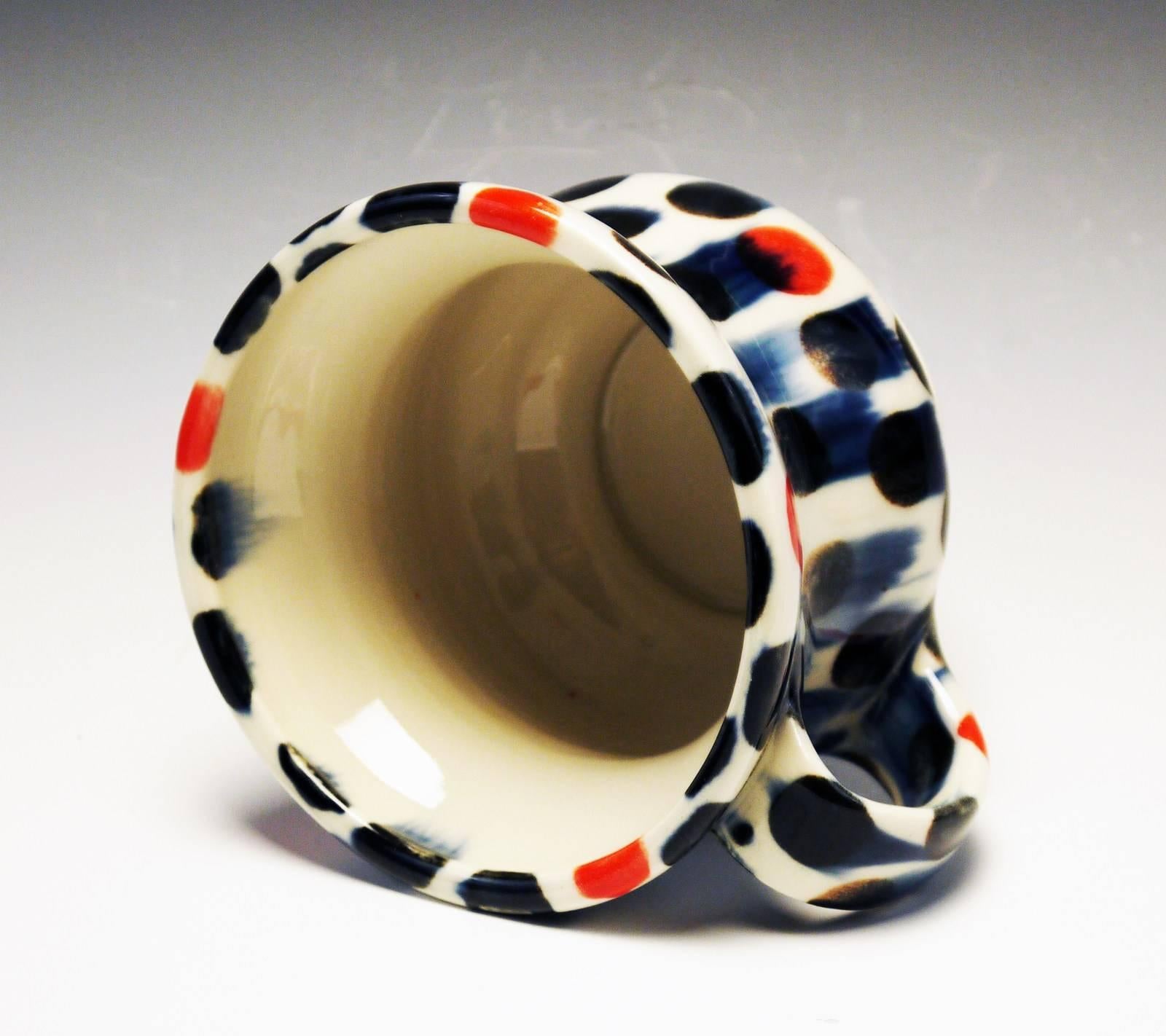 Title : Mug
Materials : Porcelain, Underglaze, Glaze
Date : 2017
Dimensions :
Description : Runny Blue/Red Dots