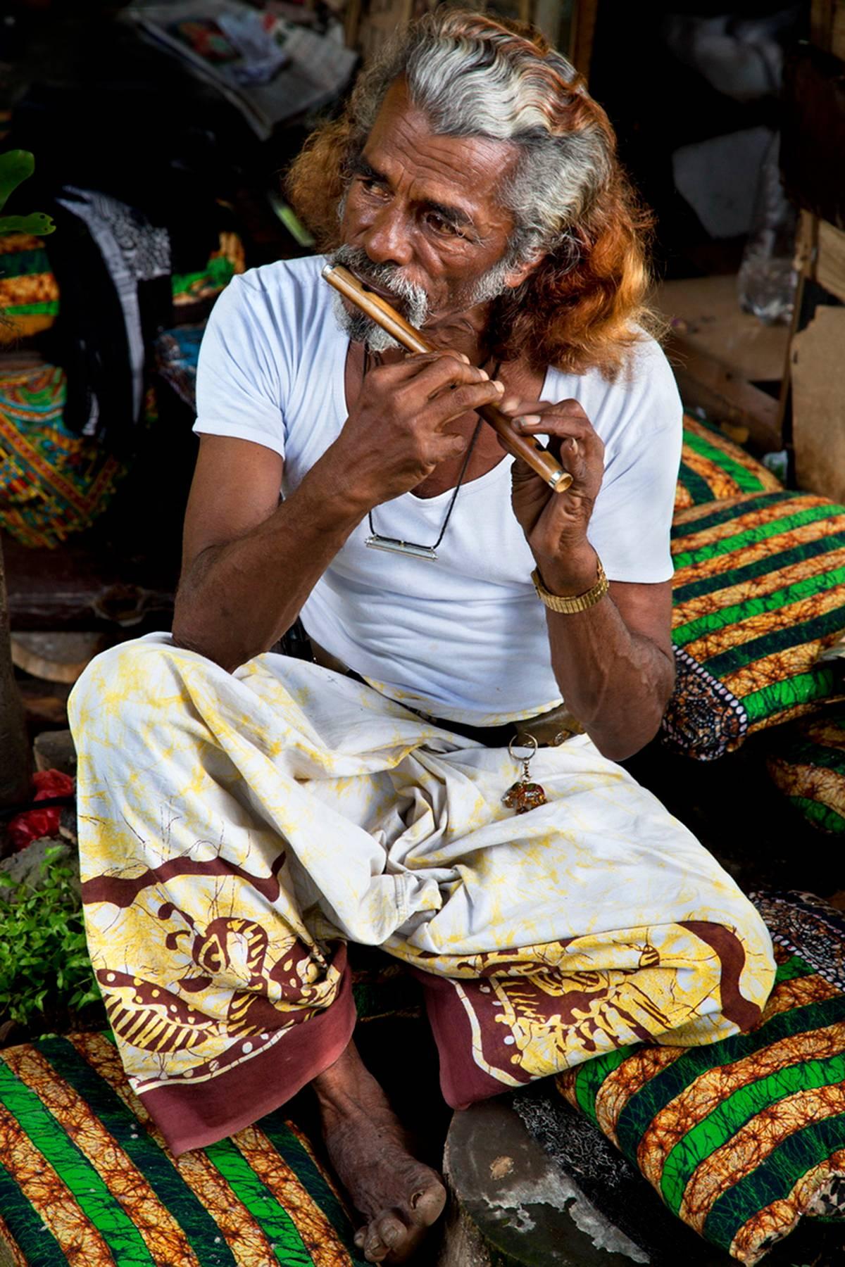 H. Allen Benowitz Color Photograph - Flute Man; Chitwan, Nepal- Photograph