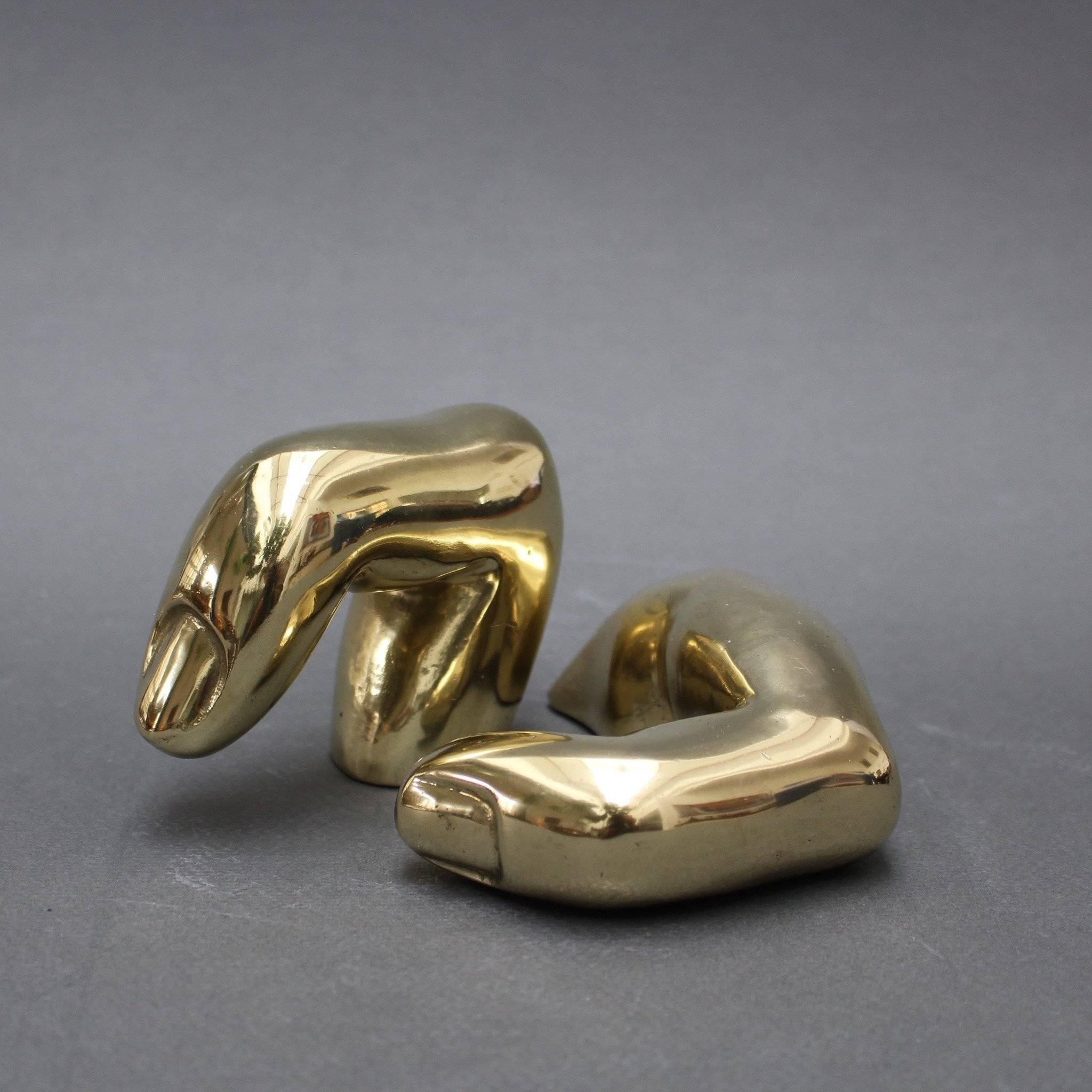 Unique gilt bronze decorative fingers by award winning artist Pietrina Checcacci (1941 -    ). Checcacci was born in Taranto, Italy but moved to Rio de Janeiro when she was 13 years old. Although her art comes in many forms, these distinctive pieces