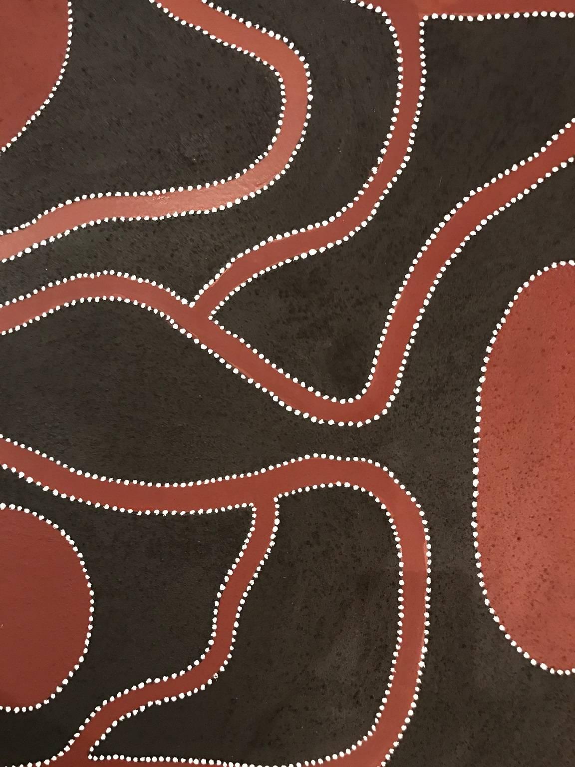 This stunning piece by Tommy Carroll is painted using natural ochres and pigments, taking on a powerful textural form.  This painting tells a story about 'Nuguwarrding' - the rainbow serpent, who travelled and lived in his grandfarther's country in