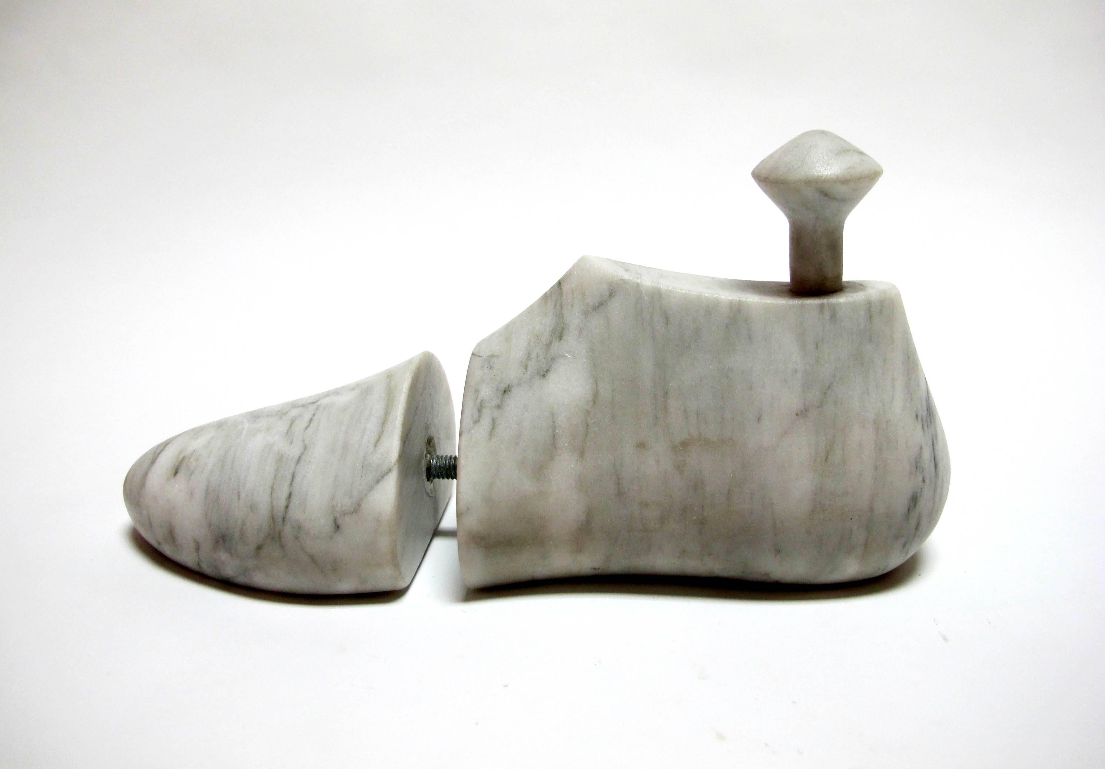 This is a gorgeous hand-carved white marble object The marble is polished and with an amazing tactile feel. The weight and the feeling of the polished marble is the best. 

This piece is celebrates our connection to natural materials and reminds us