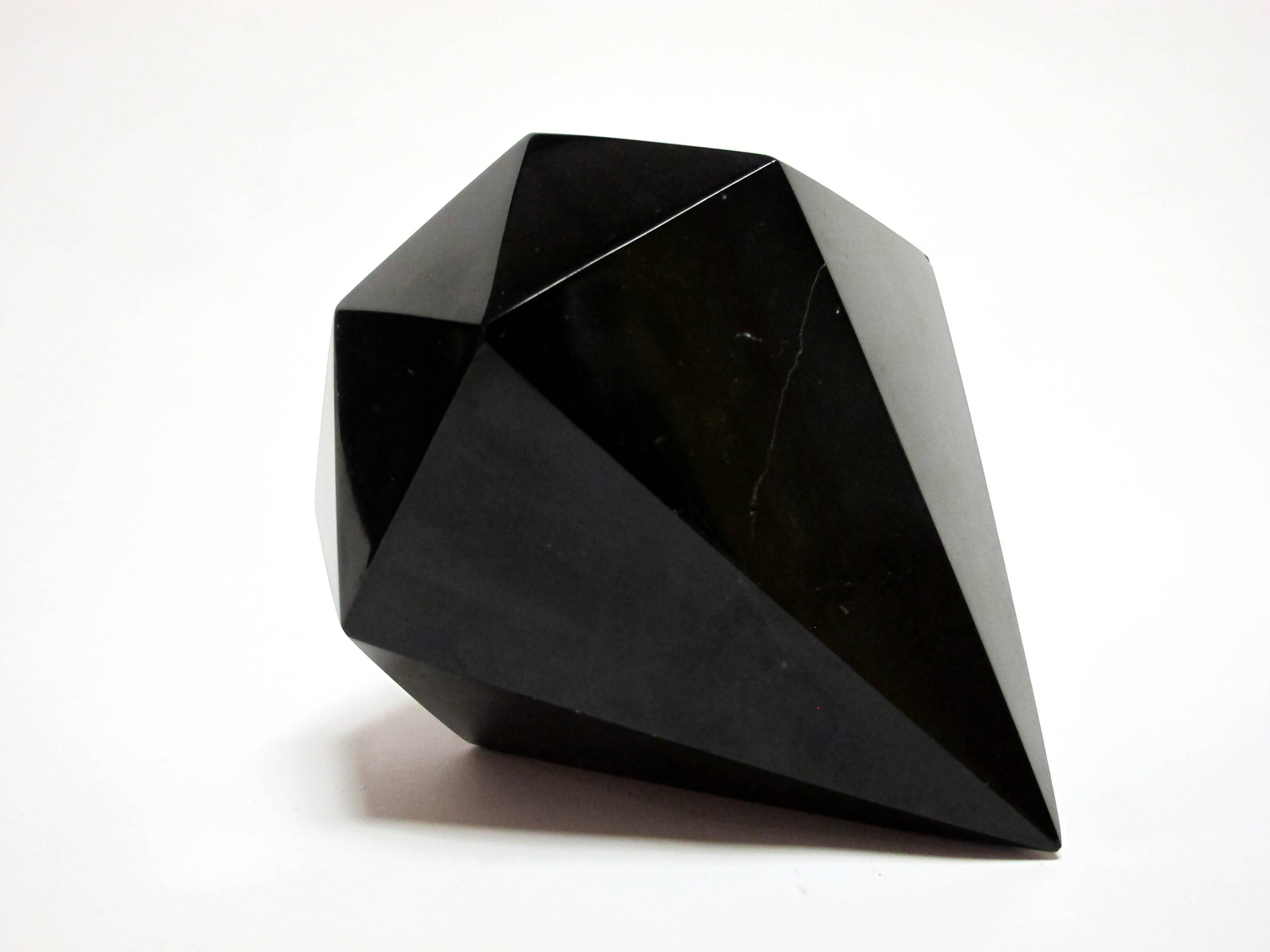 This is a gorgeous hand-carved black marble object. The marble is polished and has an amazing tactile feeling. 

This piece is celebrates our connection to everyday objects and reminds us of the importance of our tactile senses that nowadays are