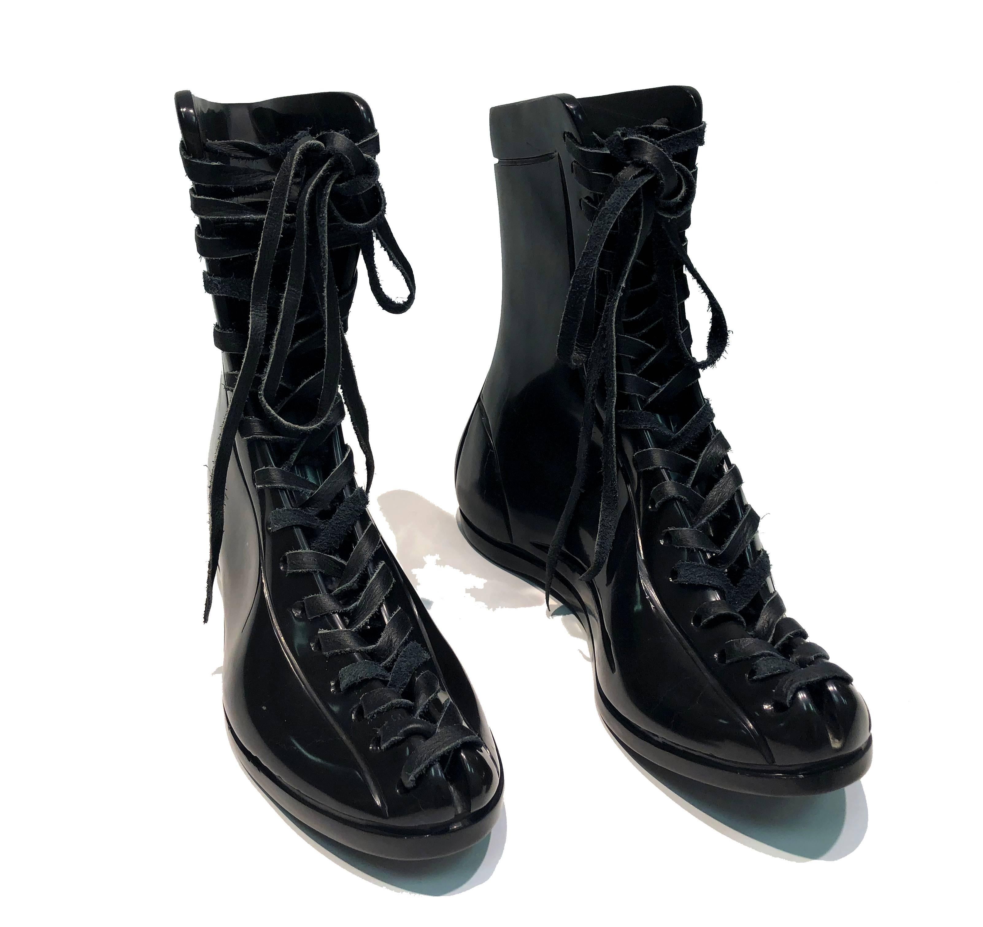 This is a gorgeous hand-carved black marble pair of boots. The marble is polished and has an amazing tactile feeling. 

These pieces celebrates our connection to everyday objects and reminds us of the importance of our tactile senses that nowadays