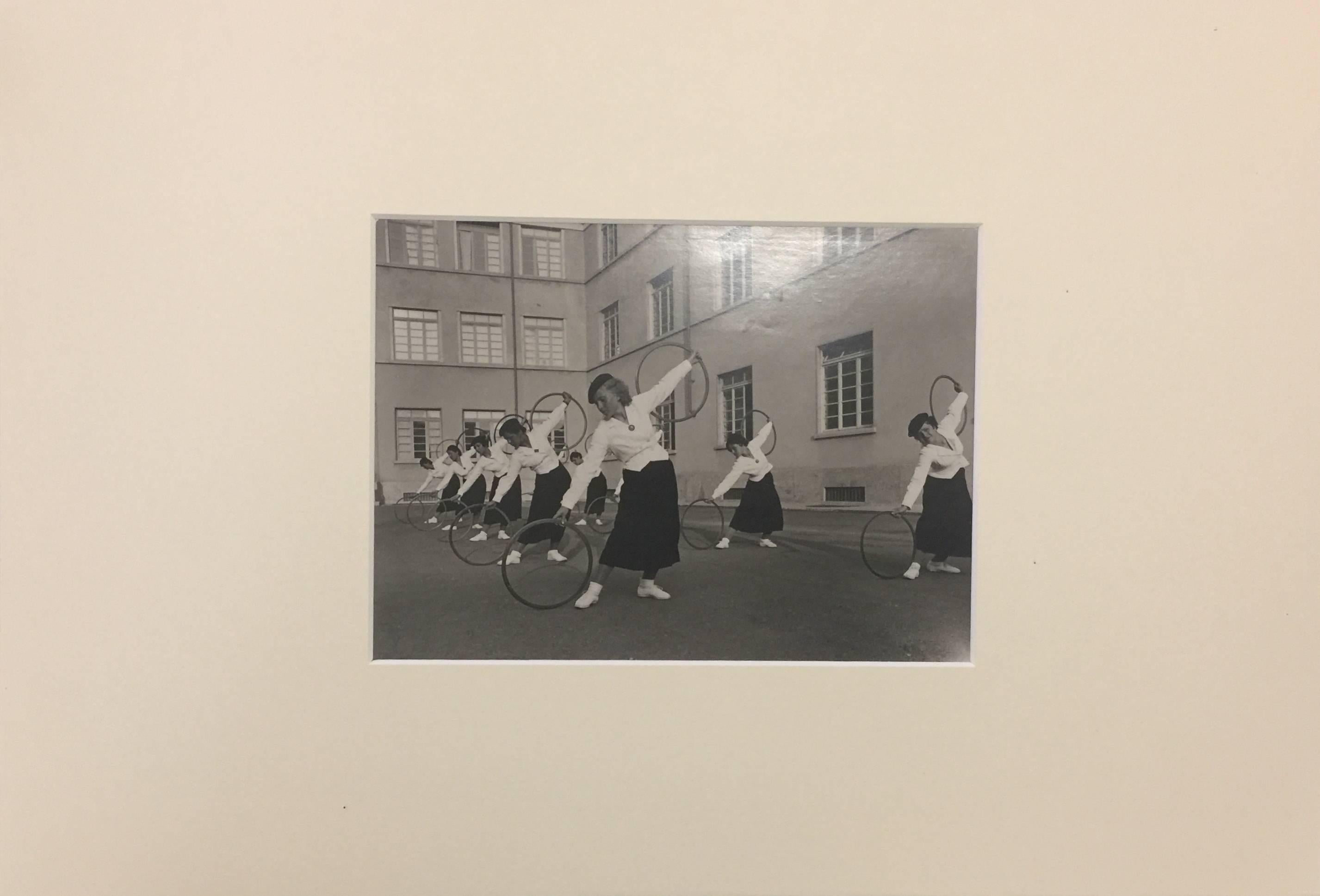 Fascism - Female Exercises with wooden hoops - Photograph by Unknown