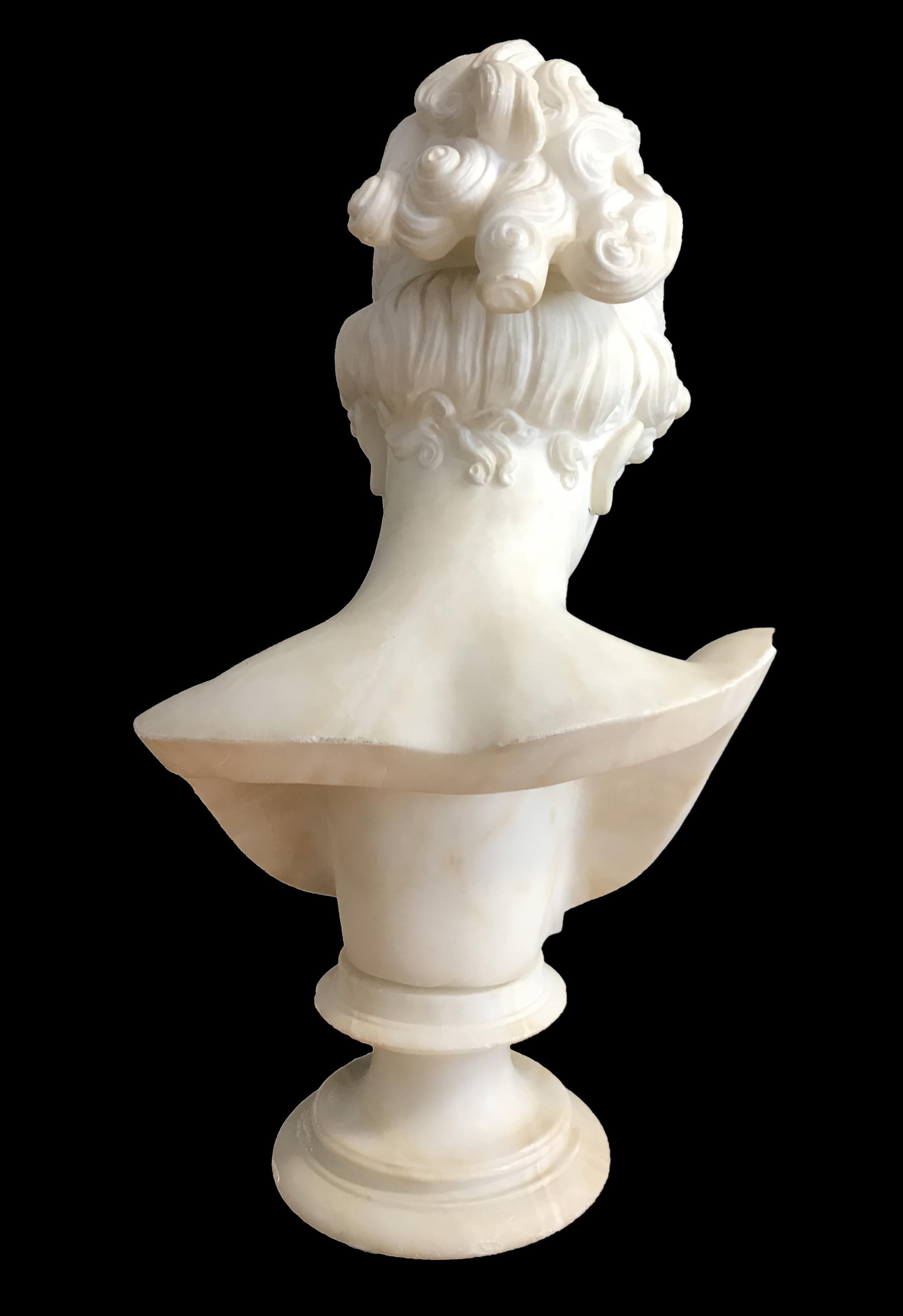 Beautiful and elegant Bust of Young Woman realized in Carrara Marble by a follower of Antonio Canova, Italy Early 19th Century.
It represents a young woman slightly inclined wearing a diadem and with hair combed in Neo-classic style, cut on