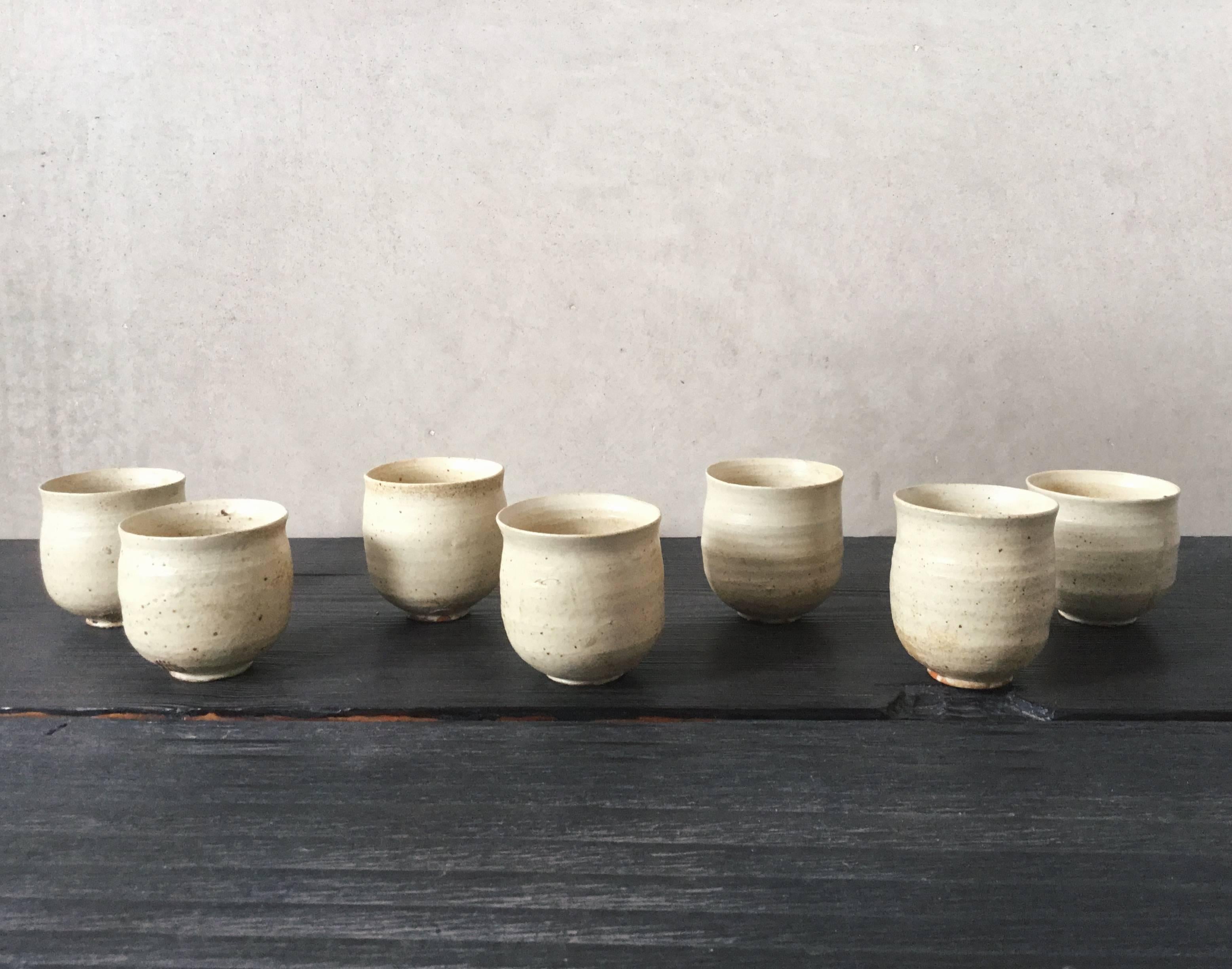 These Japanese ceramic tea cups are by Shiro Shimizu, from his famous Kyoto studio. 

The grandson of celebrated late ceramicist Mr. Uichi Shimizu, Shiro Shimizu hails from a lineage of pottery masters who dedicate themselves to the study and