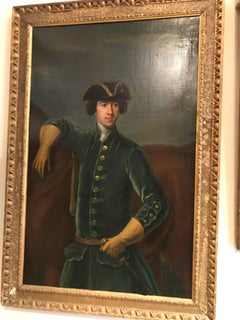 Un portrait en demi-longueur de Sir Robert Spencer en manteau débardeur bleu.