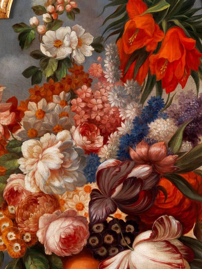 These beautiful antique oil on canvas paintings are still as beautiful today as they were roughly 250 years ago when they were painted. Depicting beautifully arranged bouquets of flowers in vases positioned at the end of tables, each painting is