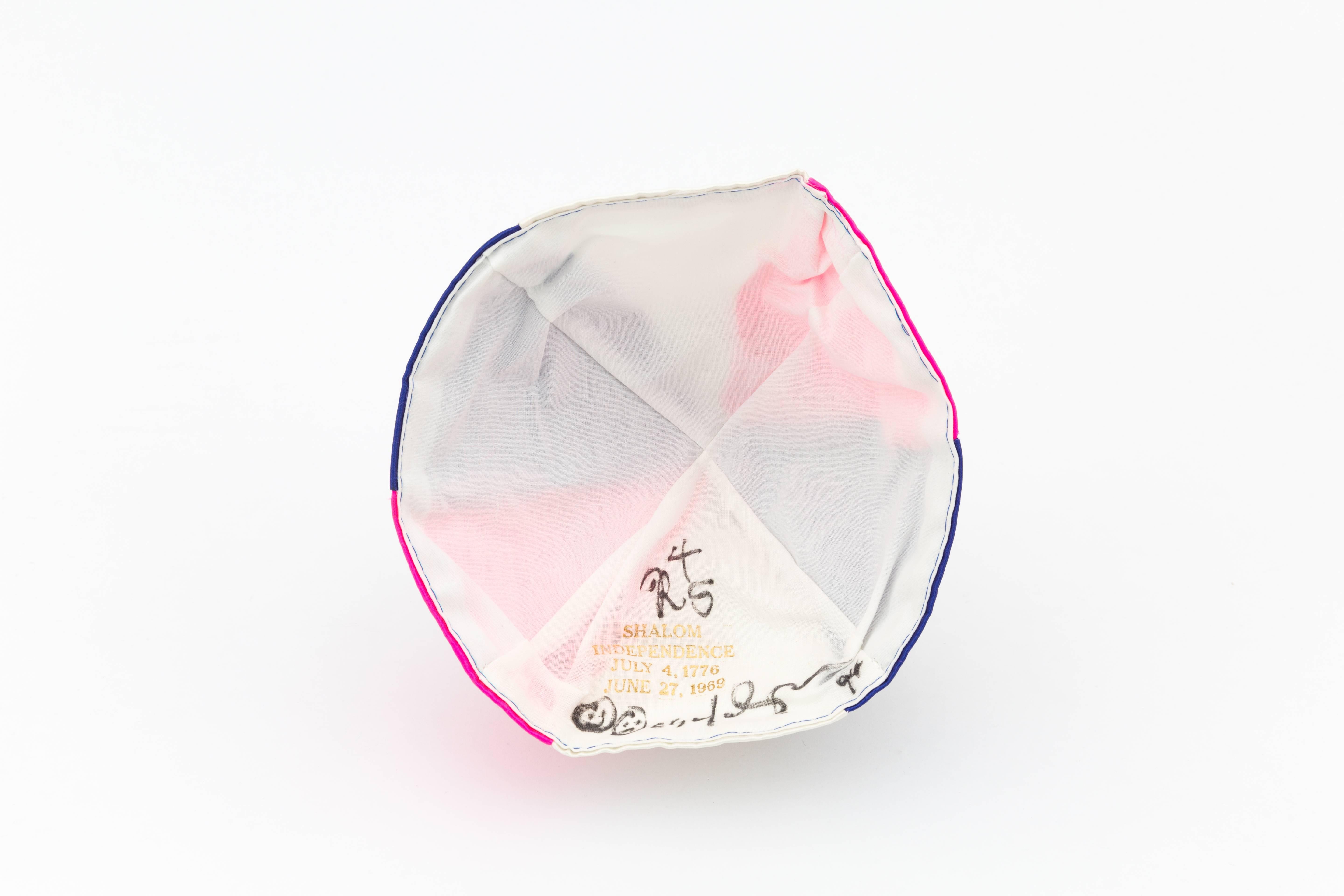 Stonewall Yarmulke (Shalom Independence: July 4, 1776-June 27, 1969), 1995
Satin yarmulke - pink, blue and white
Signed

For decades, Leibowitz has been the New York art world’s master painter of abjection and neuroses, with mockingly self-abasing