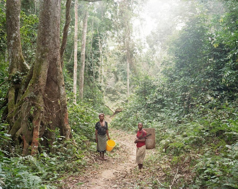 Sasha Bezzubov Portrait Photograph - Pygmy Women on the Way to Fish in the River, Northern Gabon