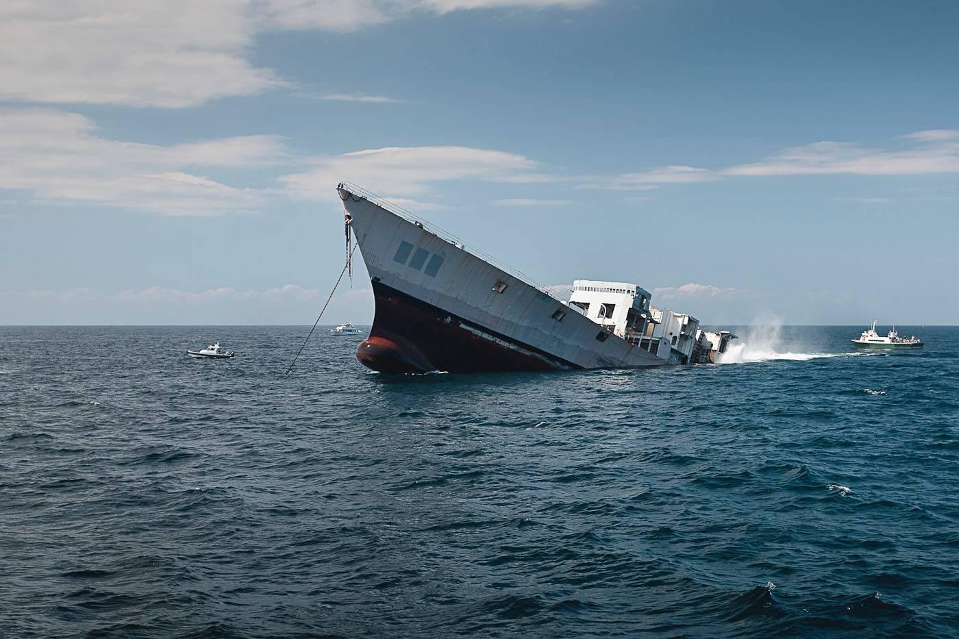 "The Reefing of the USS Radford" Color Photograph of Sinking Ship