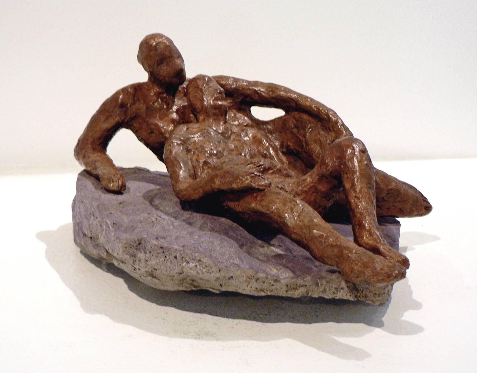 A bronze couple is comfortably laying down on a natural stone. Artist Noa Bornstein describes herself as “a draw-er”. Many of her sculptures begin as a quick drawing or impression - from memory, from dreams, or from life itself. “Watching a man