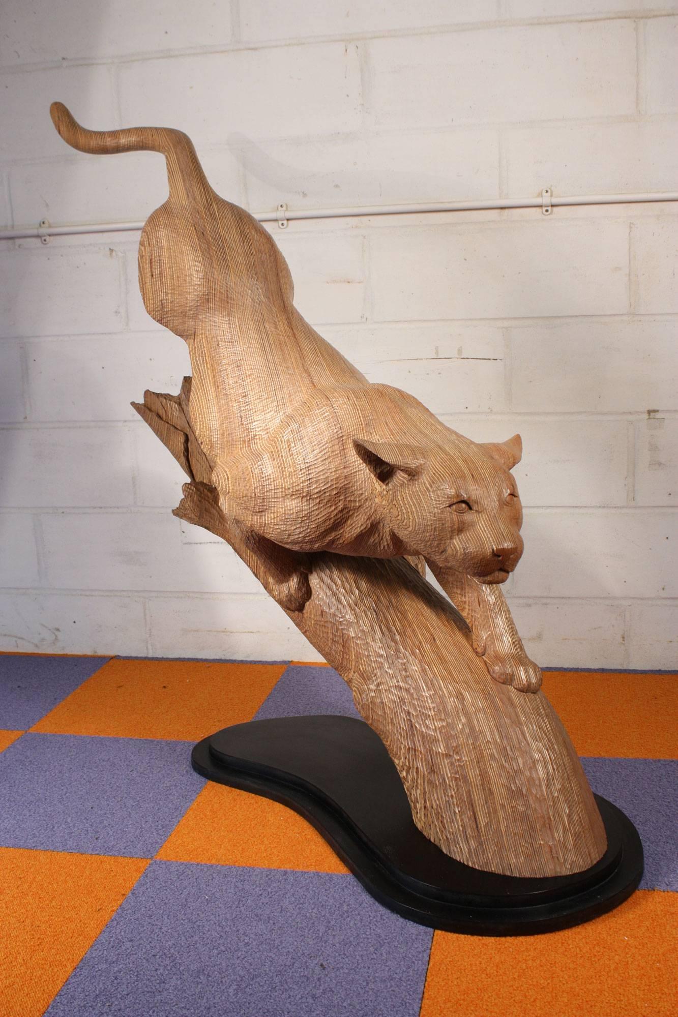 Life Sized Puma Carving By Bill Prickett
Carved in 2000

Puma preparing to pounce from blasted tree stump
Carved in laminated Latvian birch ply on a black melamine base
Carving measures Length 1230 mm ( 48.5 ins ) by Width 500 mm ( 19.5 ins )  
by