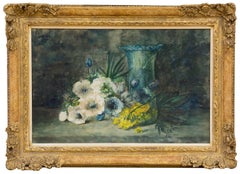 Flowers and a glass vase on a stone table