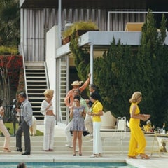 Poolside Host, 1970 by Slim Aarons - Estate Stamped C-Type 16" x 20" Photograph