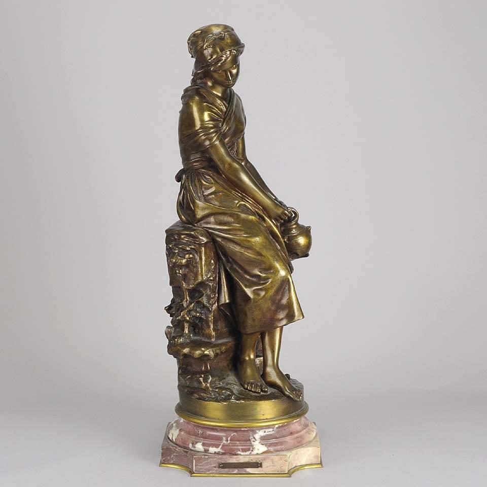 A very beautiful Art Nouveau bronze study of a young farm girl seated upon a wall in deep contemplation with a pail in her hand. Raised on a shaped marble plinth with turning mechanism that allows the viewer to appreciate the full three dimensions
