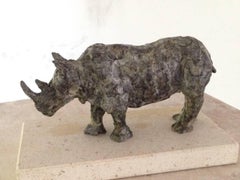 Ironclad - contemporary rhinoceros animal bronze sculpture on pedestal