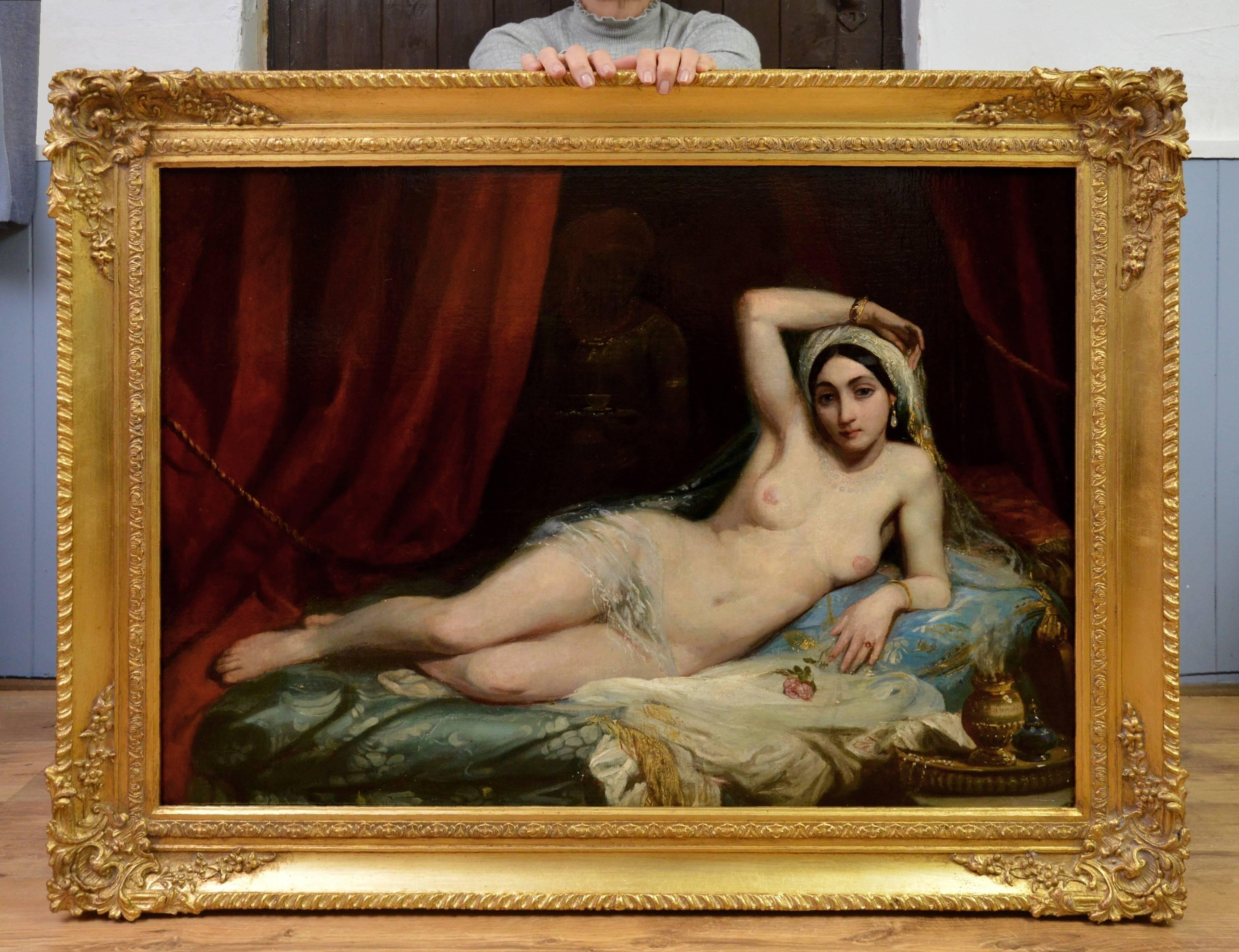 This is a large fine 19th century oil on canvas depicting a harem girl or odalisque reclining in an Oriental seraglio by an artist of the circle of the famous French painter Henri Adrien Tanoux (1865-1923). The painting hangs in a superb quality