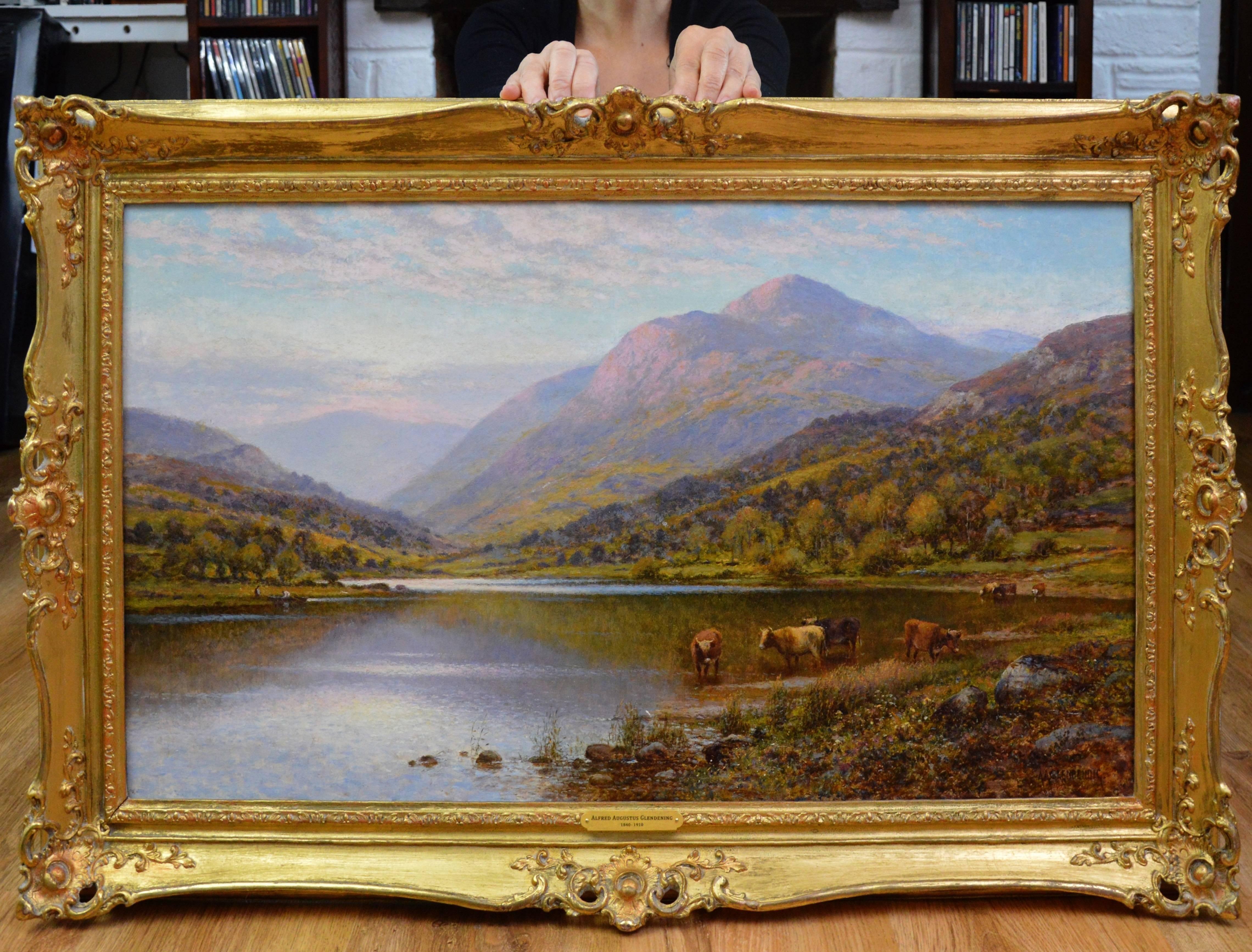 This is a fine 19th century oil on canvas depicting a spectacular Scottish Highland landscape with cattle watering at the shoreline of a loch in summertime by the famous Victorian artist Alfred Augustus Glendening Snr. (1840-1910). The painting is