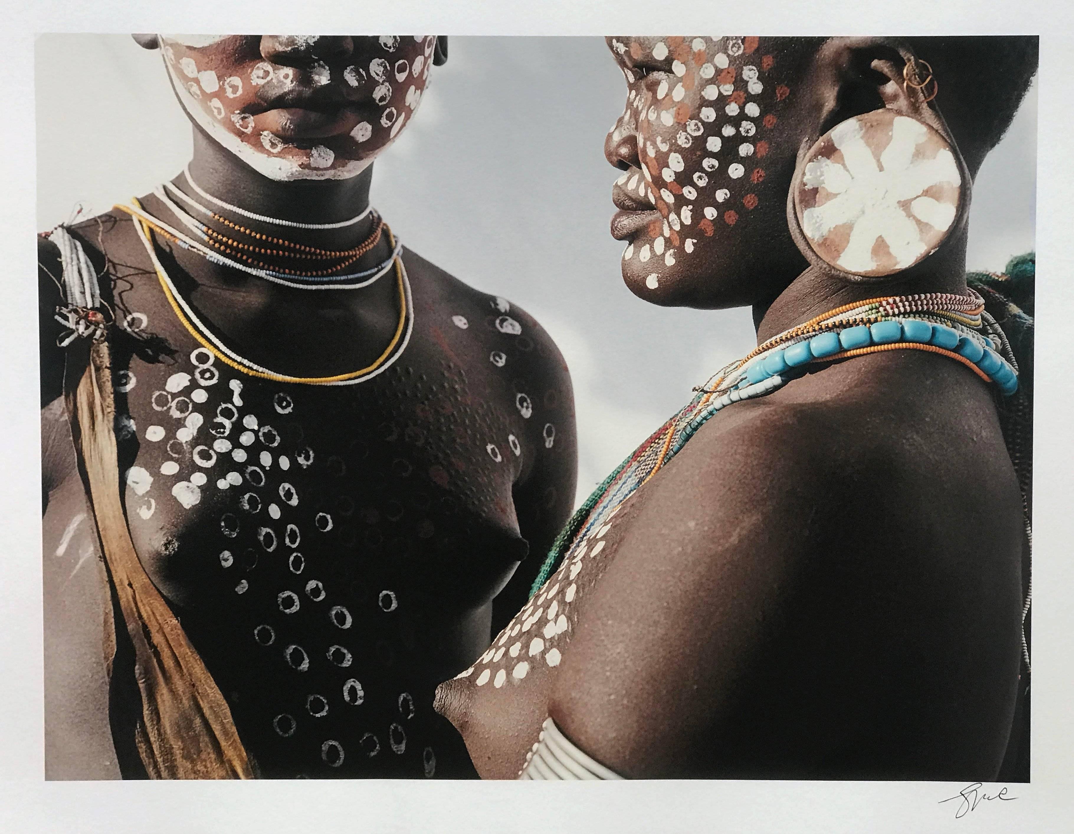 Two Sisters, Surma, Omo Valley, Ethiopia, Africa, 1996 by Jean-Michel (JM) Voge is an editioned archival pigment print, 1/5.  Signed, titled, dated on back of photo.

The artist is a former editorial photographer for magazines, such as Madame Figaro