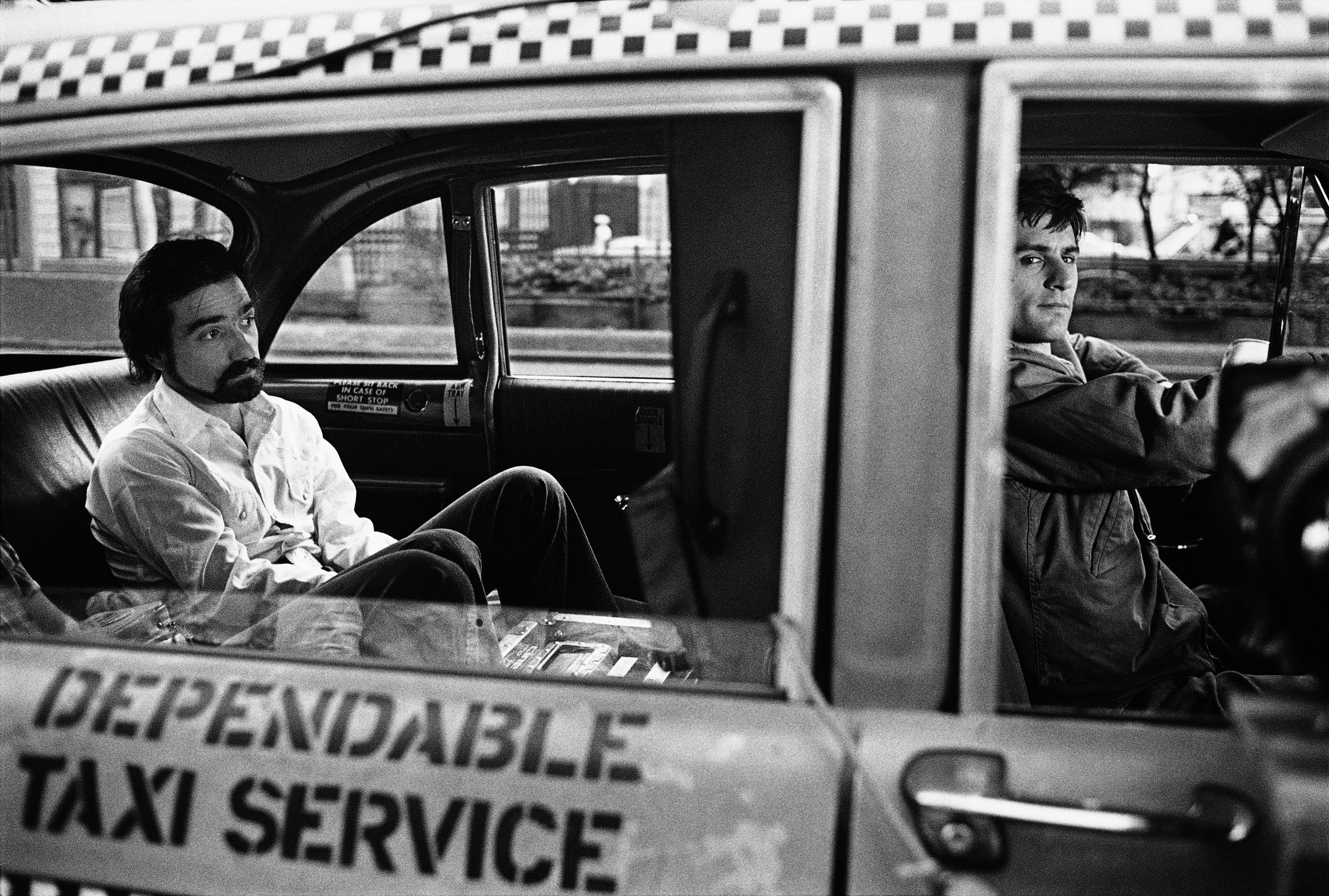 Steve Schapiro Black and White Photograph - Scorcese in Back of DeNiro's Cab, Taxi Driver, New York, 1975