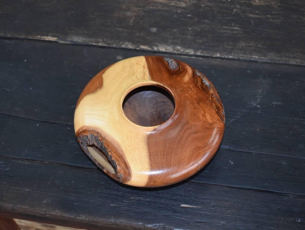 Carmie  (1959-)  Mesquite Hollow Form  Height 2.5''  Diameter 7.5''
Bio
Carmie (1959-) 
Wood Turner Carmie K. Acosta was born and raised in San Antonio. By day he works as a synthetic organic chemist specializing in steroid synthesis. His foray into