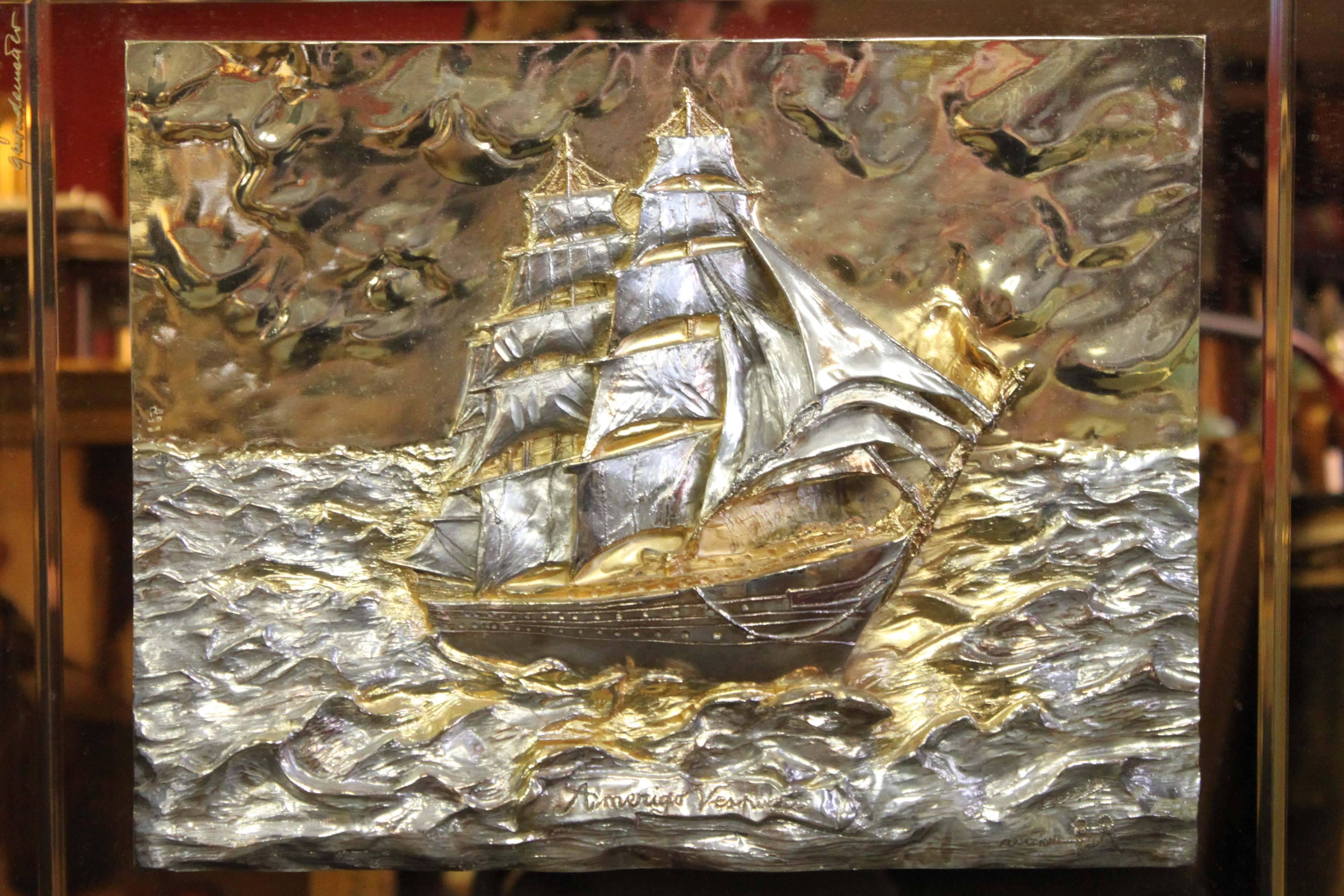 Gold ship wall plaque by Amerigo Vespucci, signed.