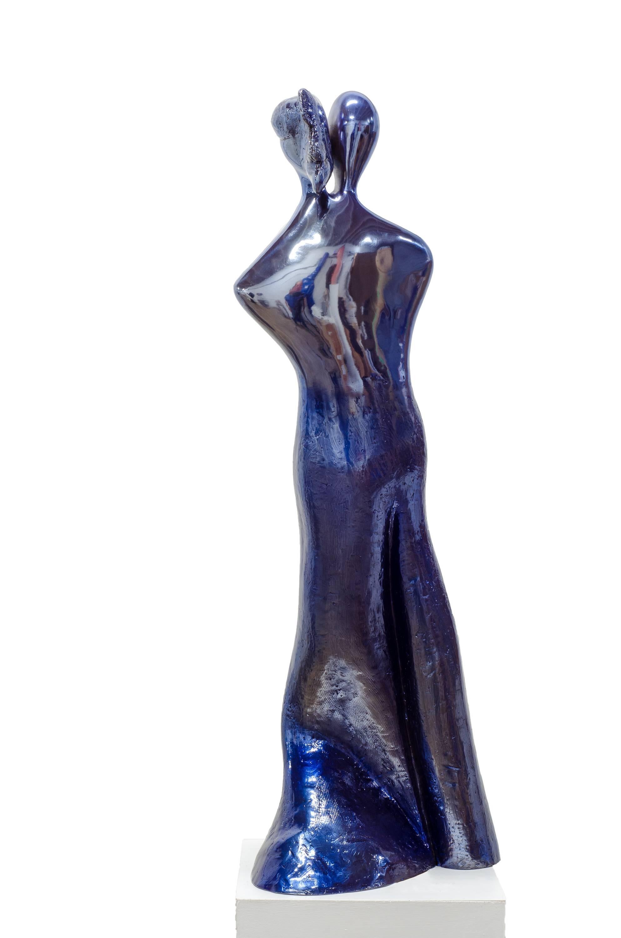 When In love, their souls and bodies fuse into just one. Soul Mates #1 (in blue) is a contemporary bronze sculpture by Beatriz Gerenstein where the artist plays with the deep mysteries of love. This artwork shows two human figures standing up and