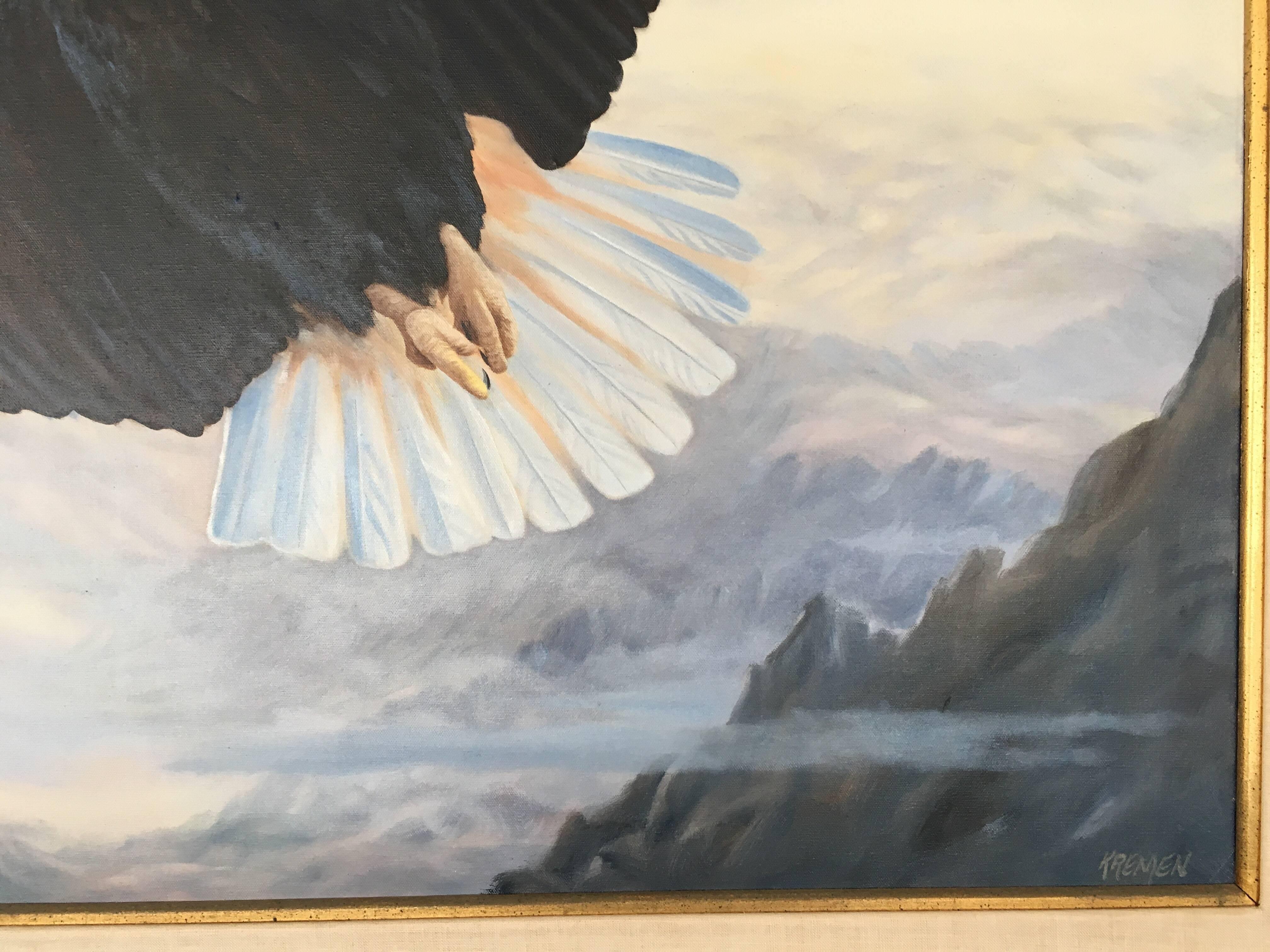 Eagle in Flight by Gary Kremen (1949-2001). Late century painting, with hand-carved rustic wood frame lined with linen and gold leaf. A realistic depiction of an eagle in flight soaring above a rocky mountain range and an atmospheric purple, gray