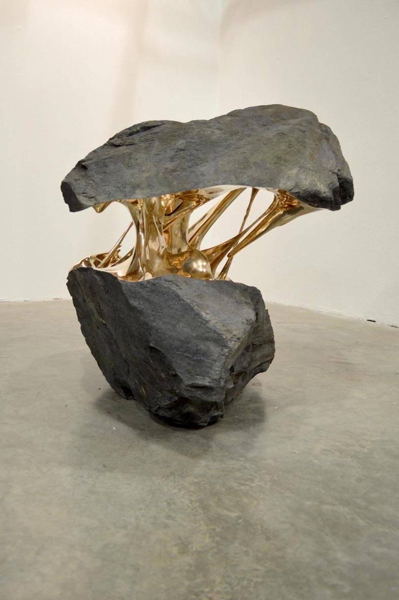 Space Attraction, bisected boulder bronze sculpture