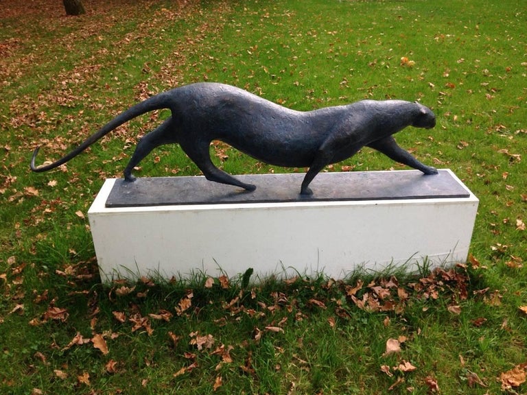 Grand Félin (Big Feline) is a large-scale bronze sculpture by French contemporary artist Pierre Yermia which represents a walking feline (a leopard, a jaguar or a cheetah). The dark patina with blue shades emphasizes the mysterious elegance of its