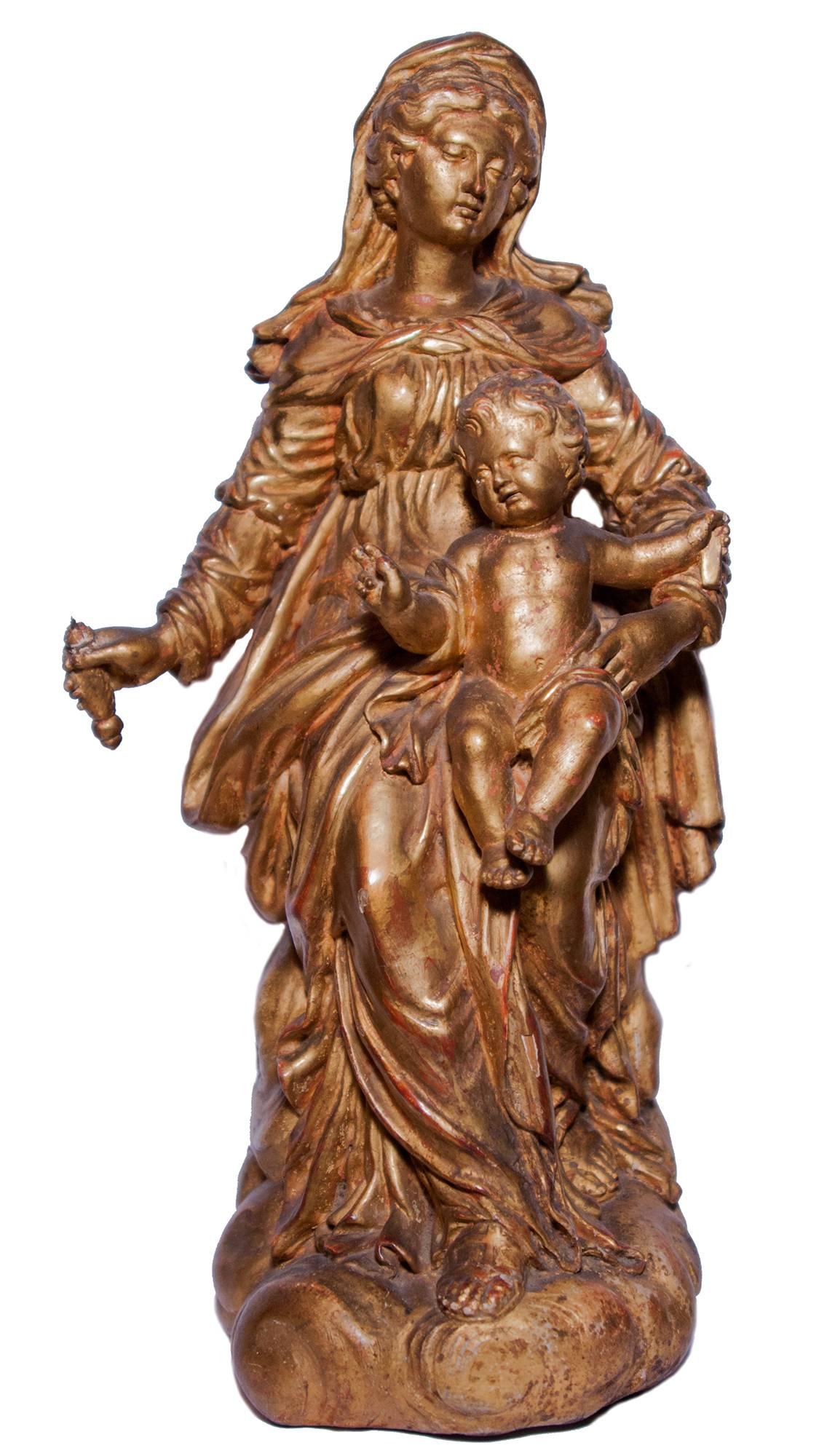 Unknown Figurative Sculpture - Virgin and Child in carved and gilt wood, circa 1700