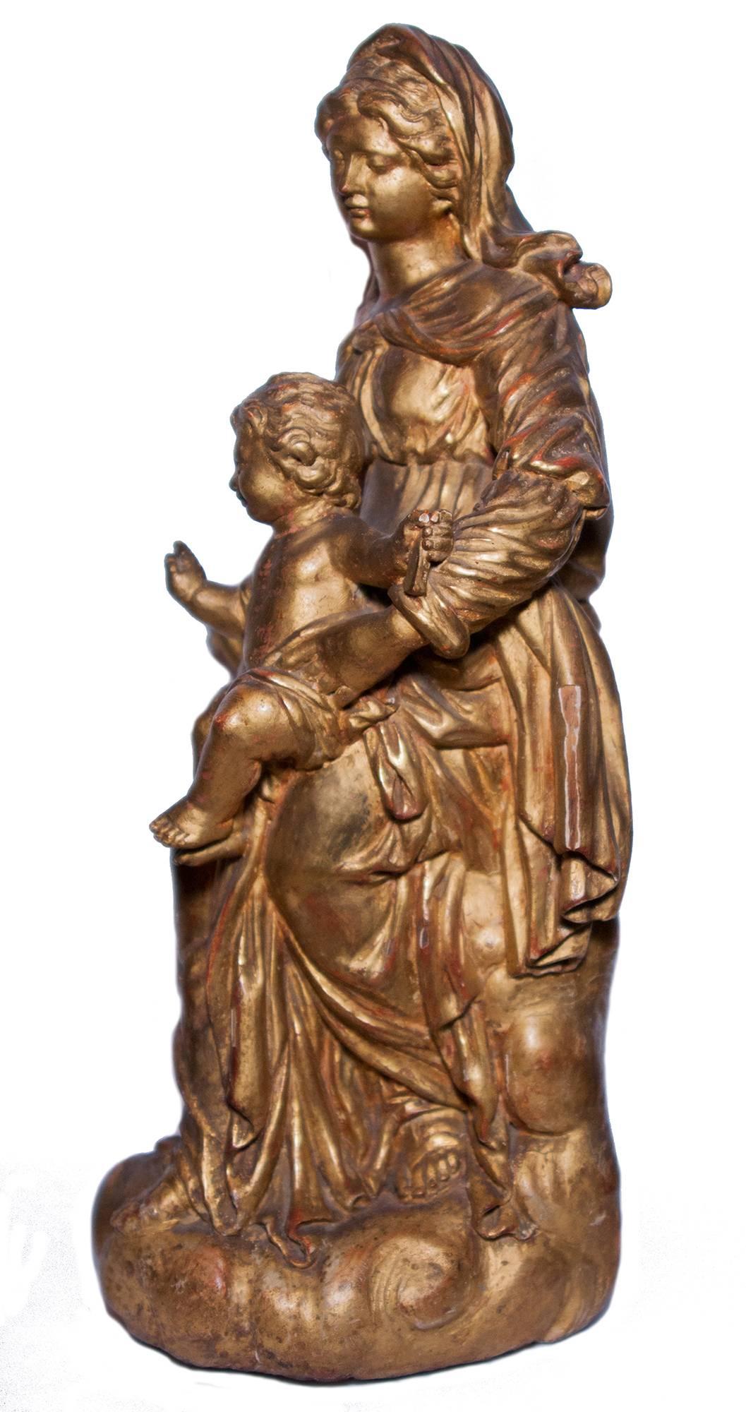 Virgin and Child in carved and gilt wood, circa 1700 - Baroque Sculpture by Unknown