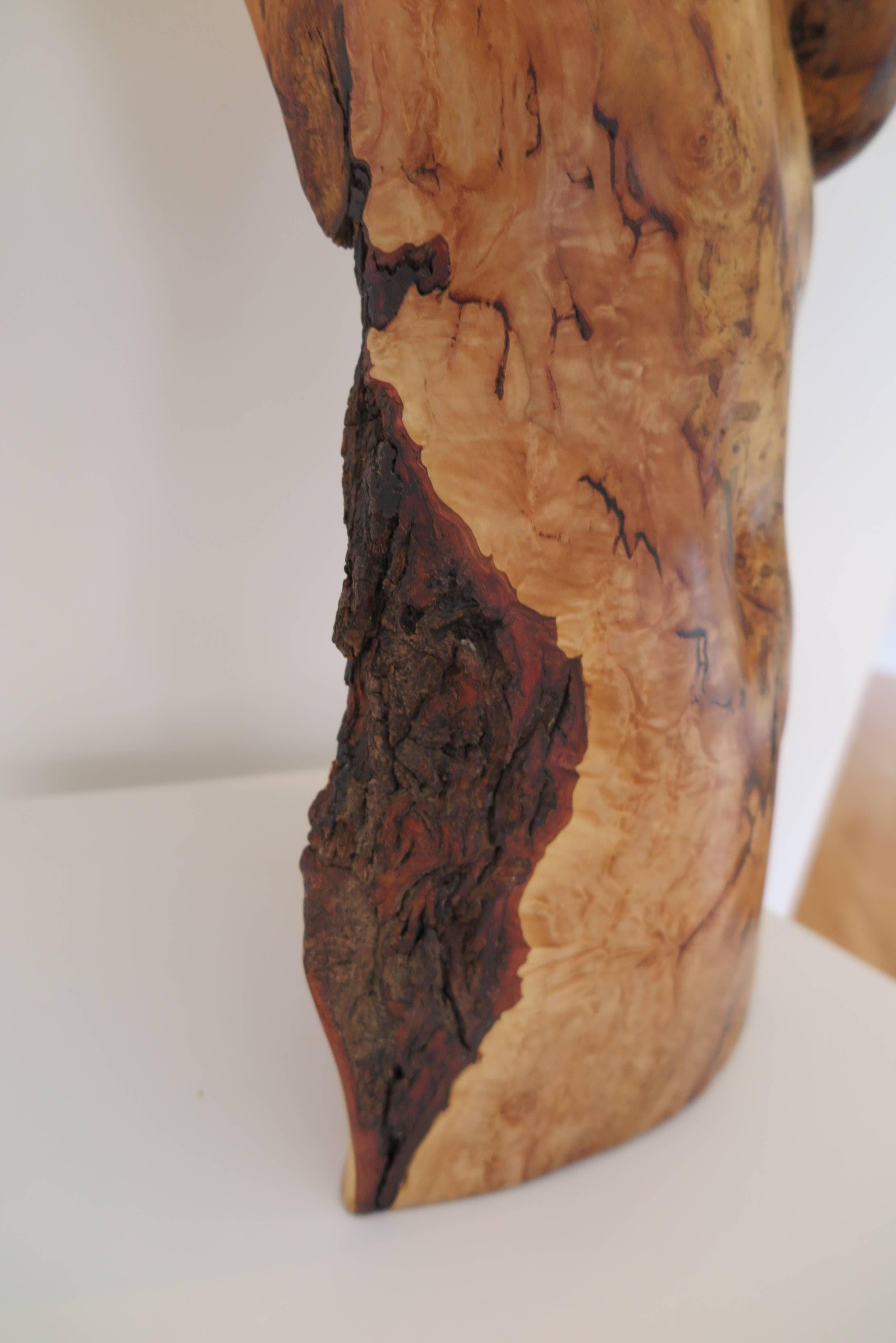 Hand carved figurative wood sculpture by Georgia artist Chad Awalt. 

