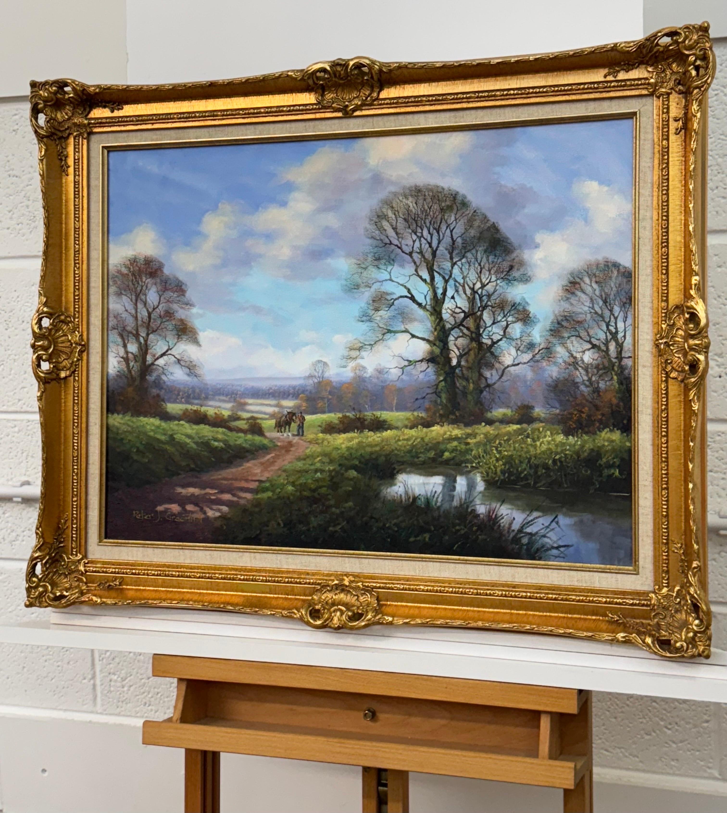 Caballo Shire y hombre junto a un río en la campiña inglesa por el artista británico Peter J Greenhill 

Medidas: 24 x 18 pulgadas
El marco mide 30 x 24 pulgadas

Peter J. Greenhill (n.1939, británico)
Óleo sobre lienzo
