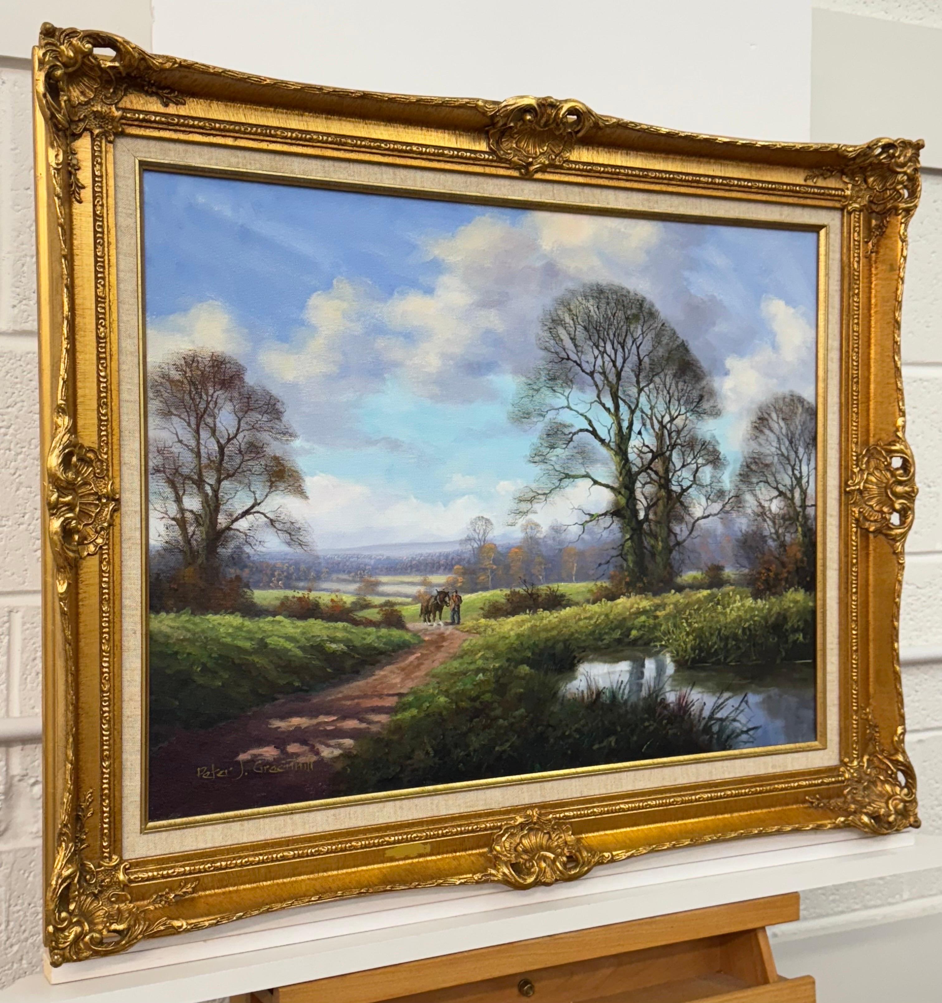 Caballo de Shire y hombre junto a río arbolado en la campiña inglesa por artista británico en venta 7