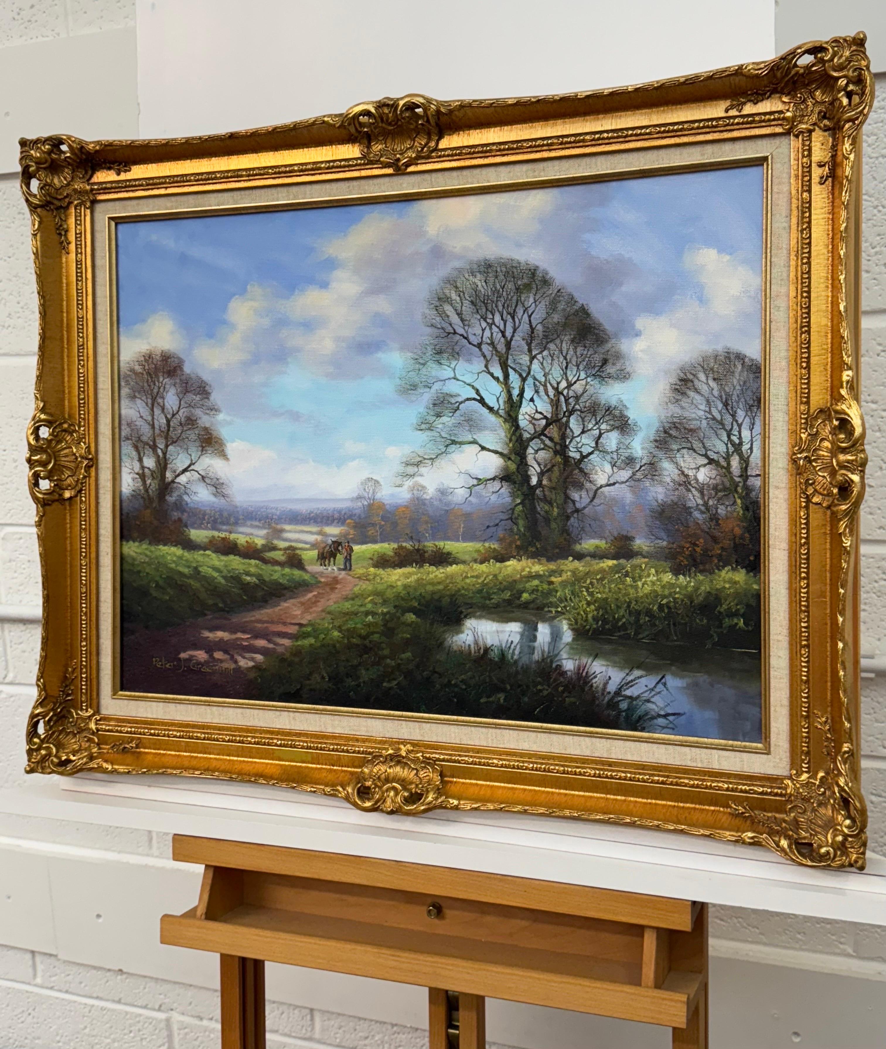 Caballo de Shire y hombre junto a río arbolado en la campiña inglesa por artista británico en venta 13