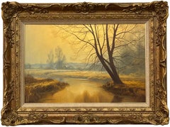 Paisaje brumoso de un río amarillo dorado con árboles invernales en la campiña inglesa