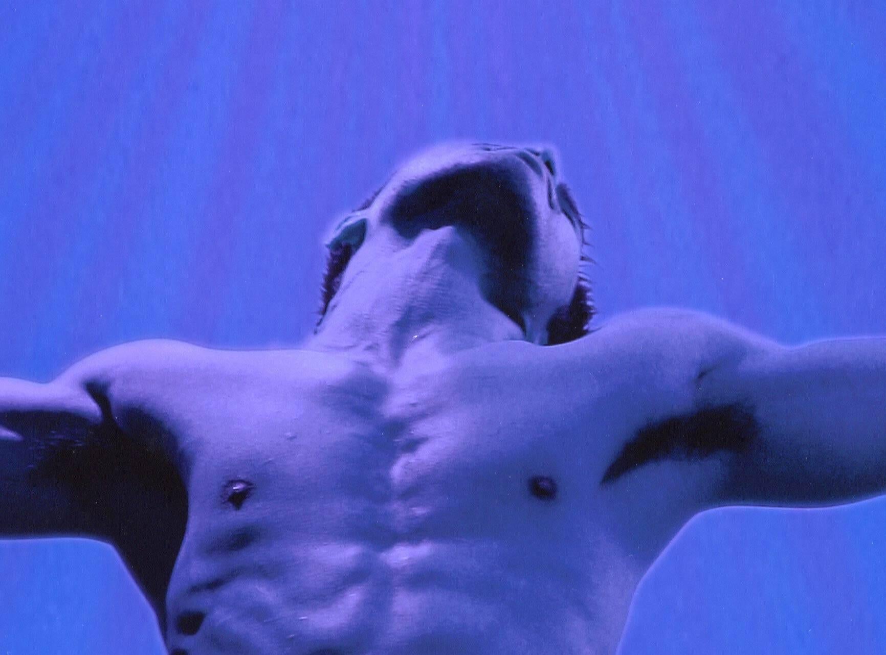 Salvation (full frontal male nude in Christ like resurrection pose printed blue) - Photograph by Dylan Ricci