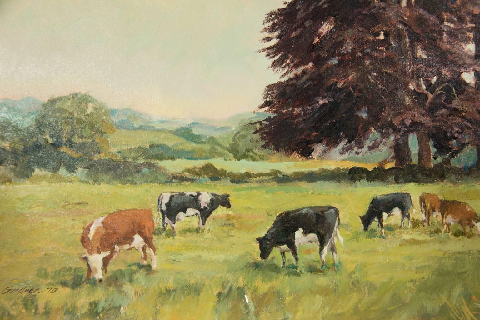 A signed 1979 painting by the artist Reginald Gardner, depicting grazing cows in a landscape. Signed and dated in the lower left. Painted on board.